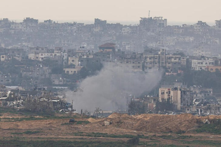 Smoke rises over Gaza during Israeli strikes as seen from southern Israel