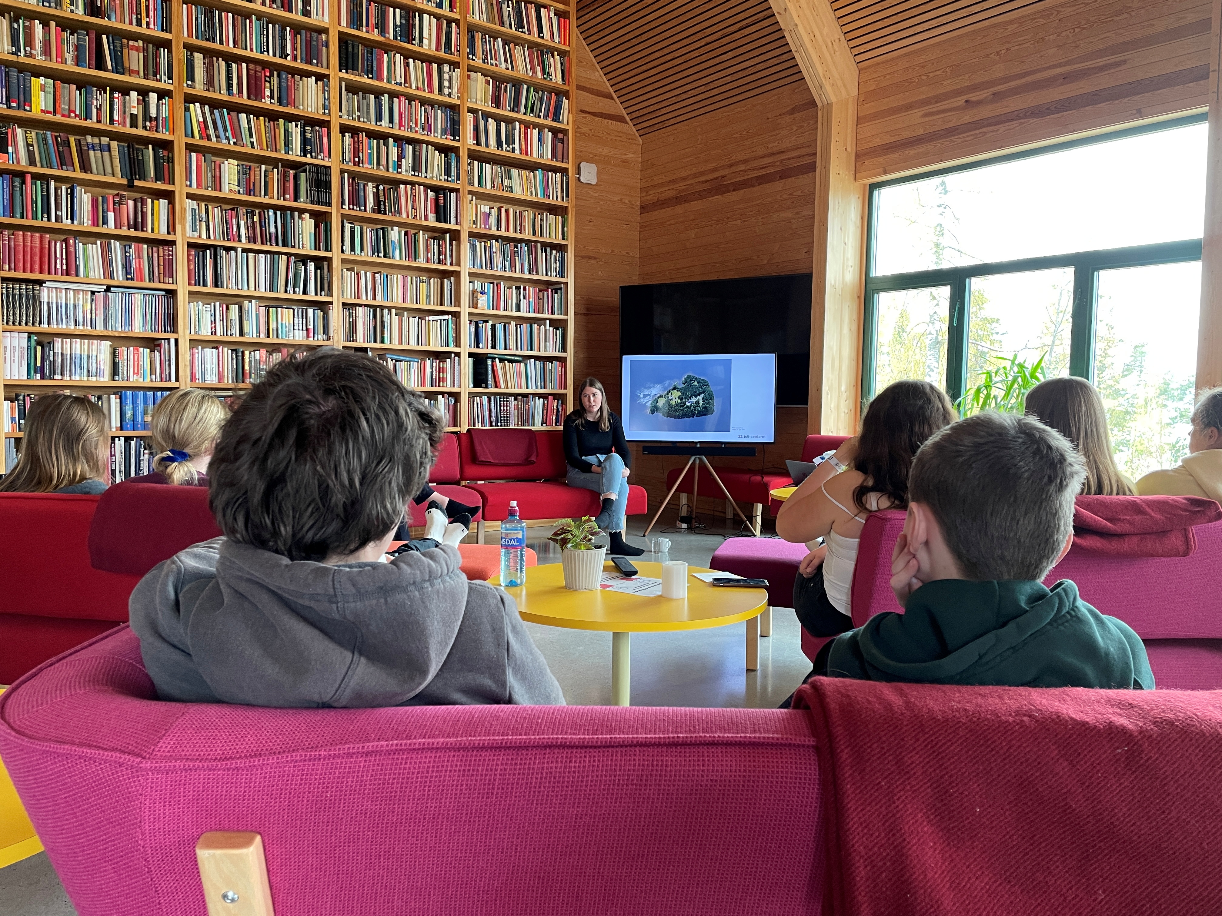 Astrid Hoem, a survivor of the 2011 shooting on Utoeya, speaks with teenagers about her experiences of that day, in a library at Utoeya island, Norway May 11, 2021. REUTERS/Gwladys Fouche