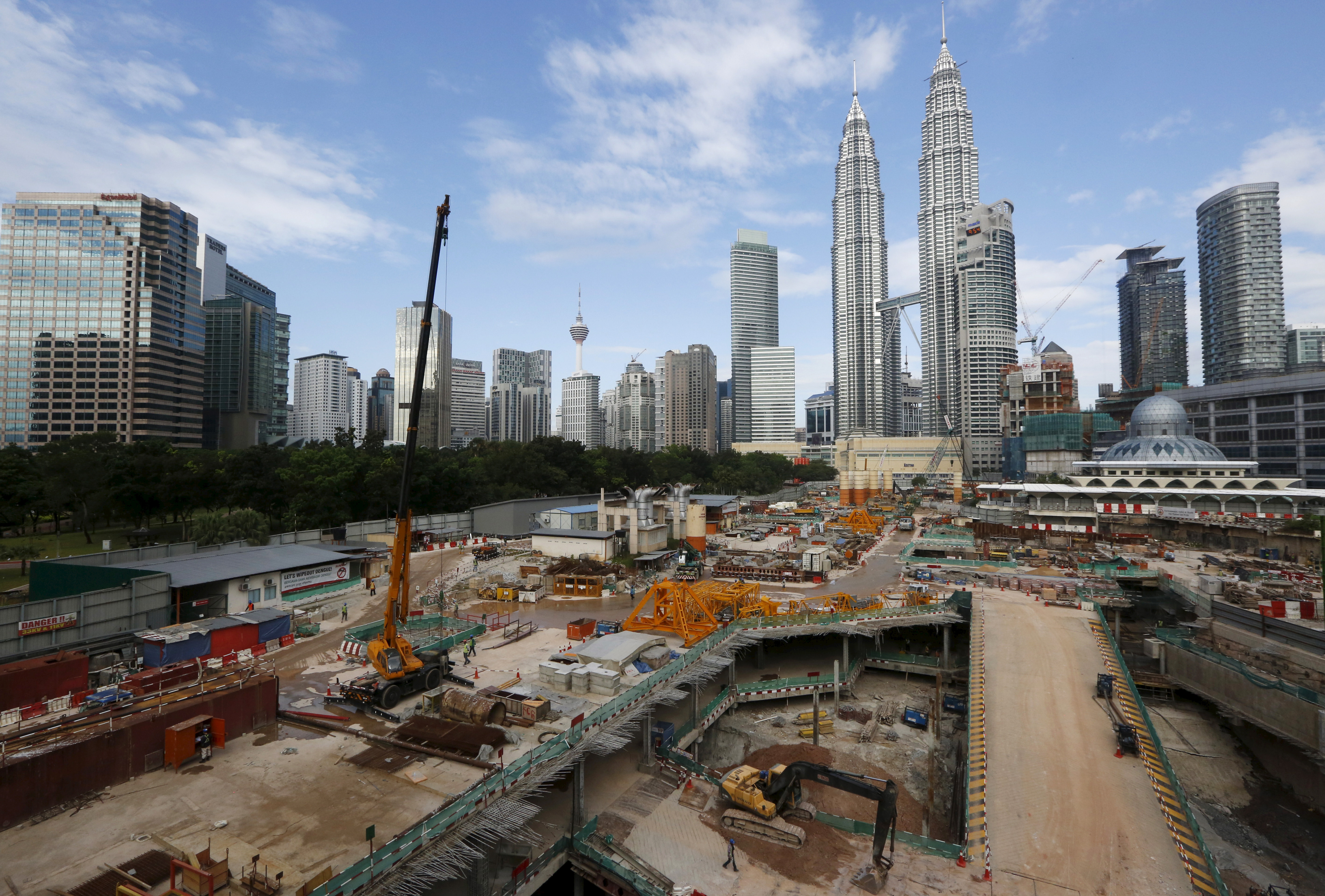 A view of a building site beneath the Petronas Towers in Kuala Lumpur