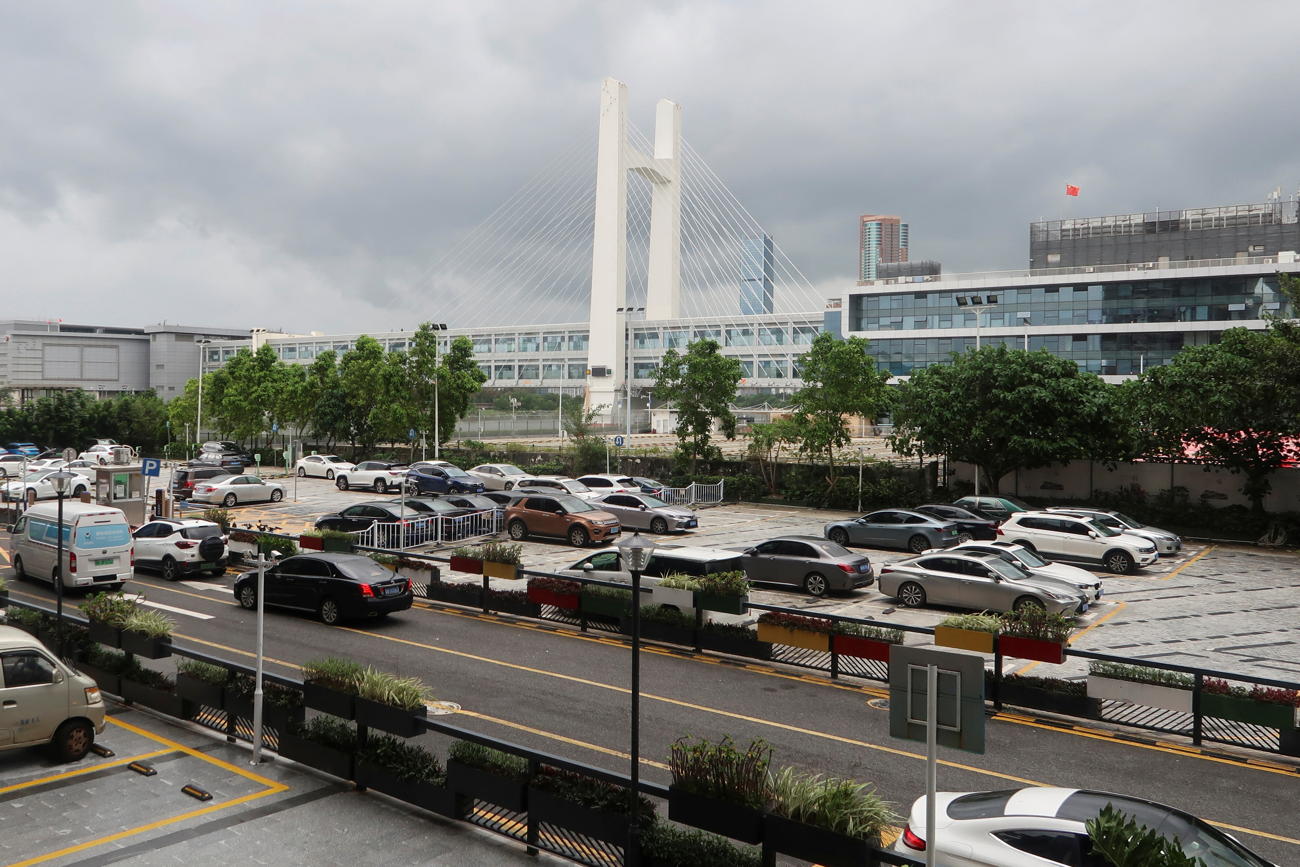 Cars park beside Futian Checkpoint in Shenzhen