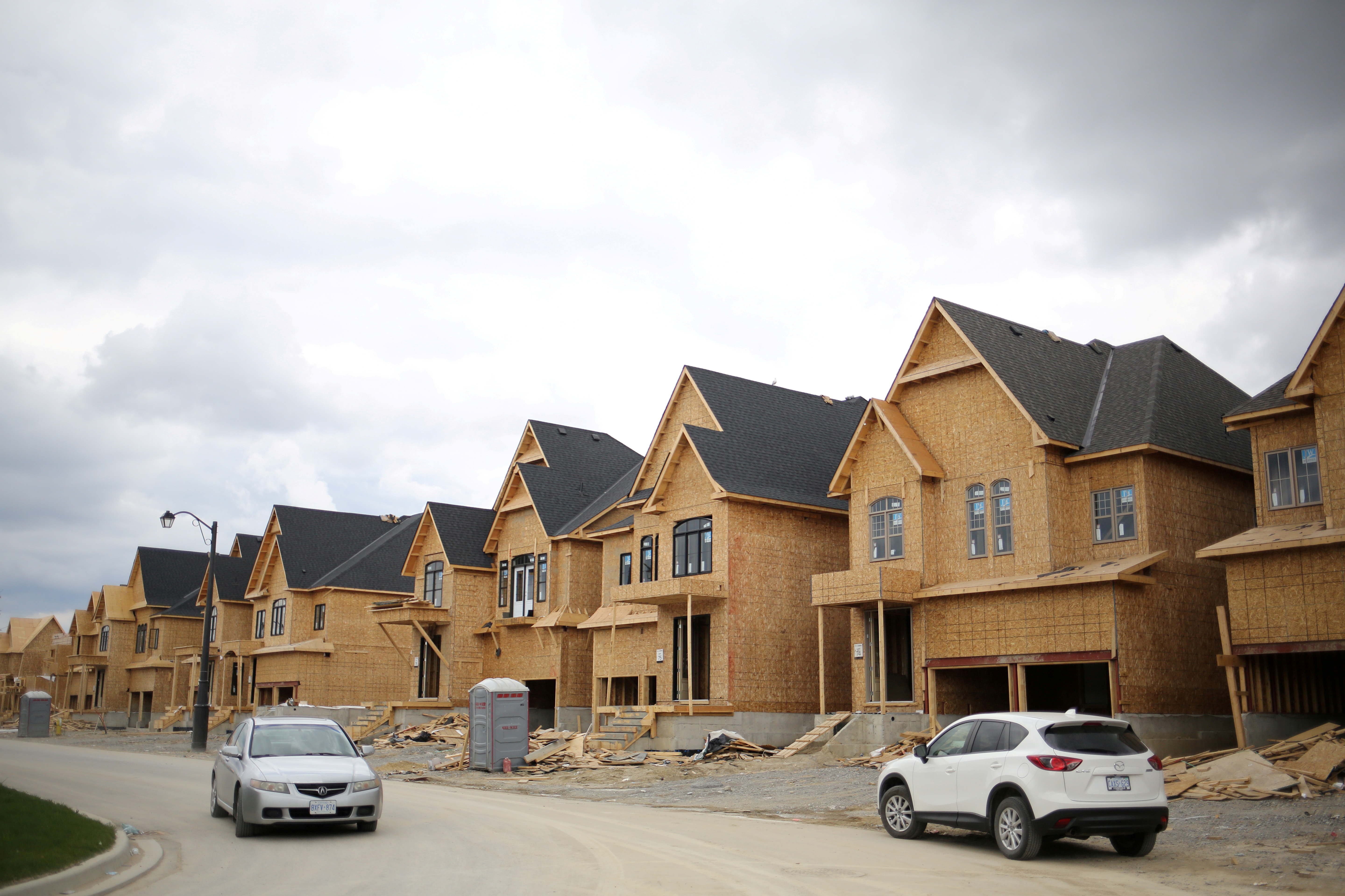 A row of houses under construction is seen at a subdivision near the town of Kleinburg