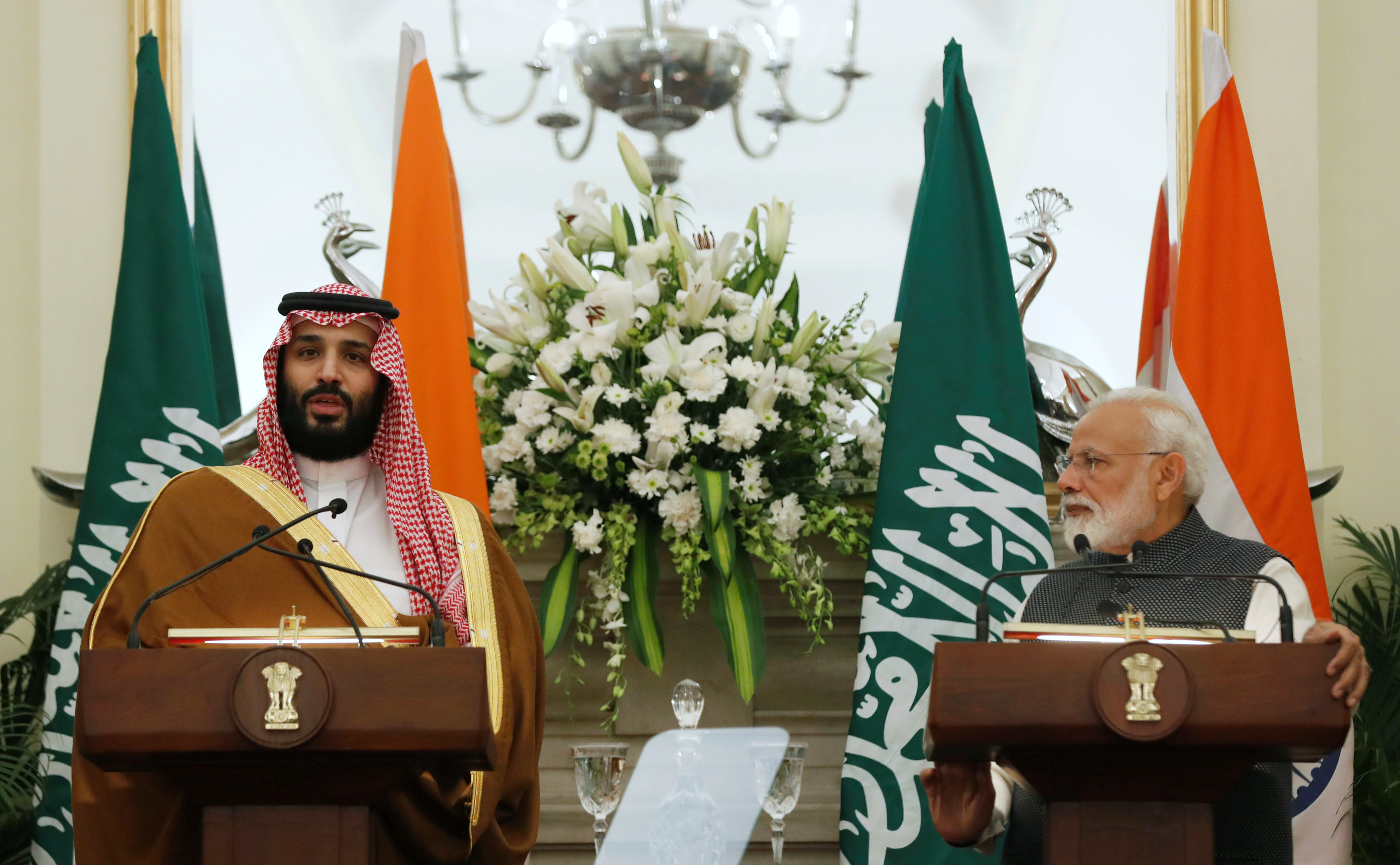 Saudi Arabia's Crown Prince Mohammed bin Salman speaks at a meeting with Indian Prime Minister Narendra Modi as he looks on, at Hyderabad House in New Delhi