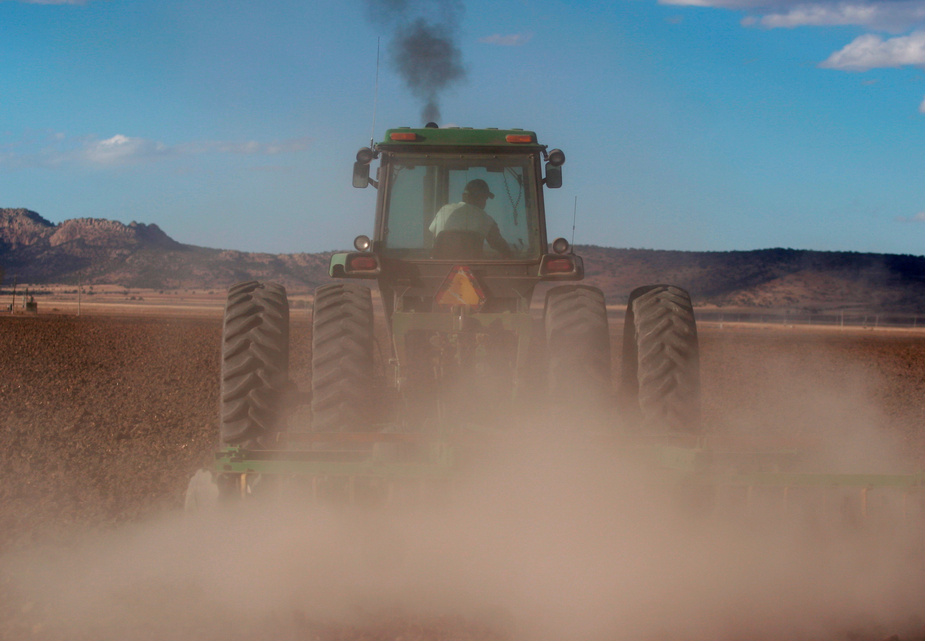A tractor ploughs a hectare of land at Ejido Benito Juarez in the northern Mexican state of Chihuahua