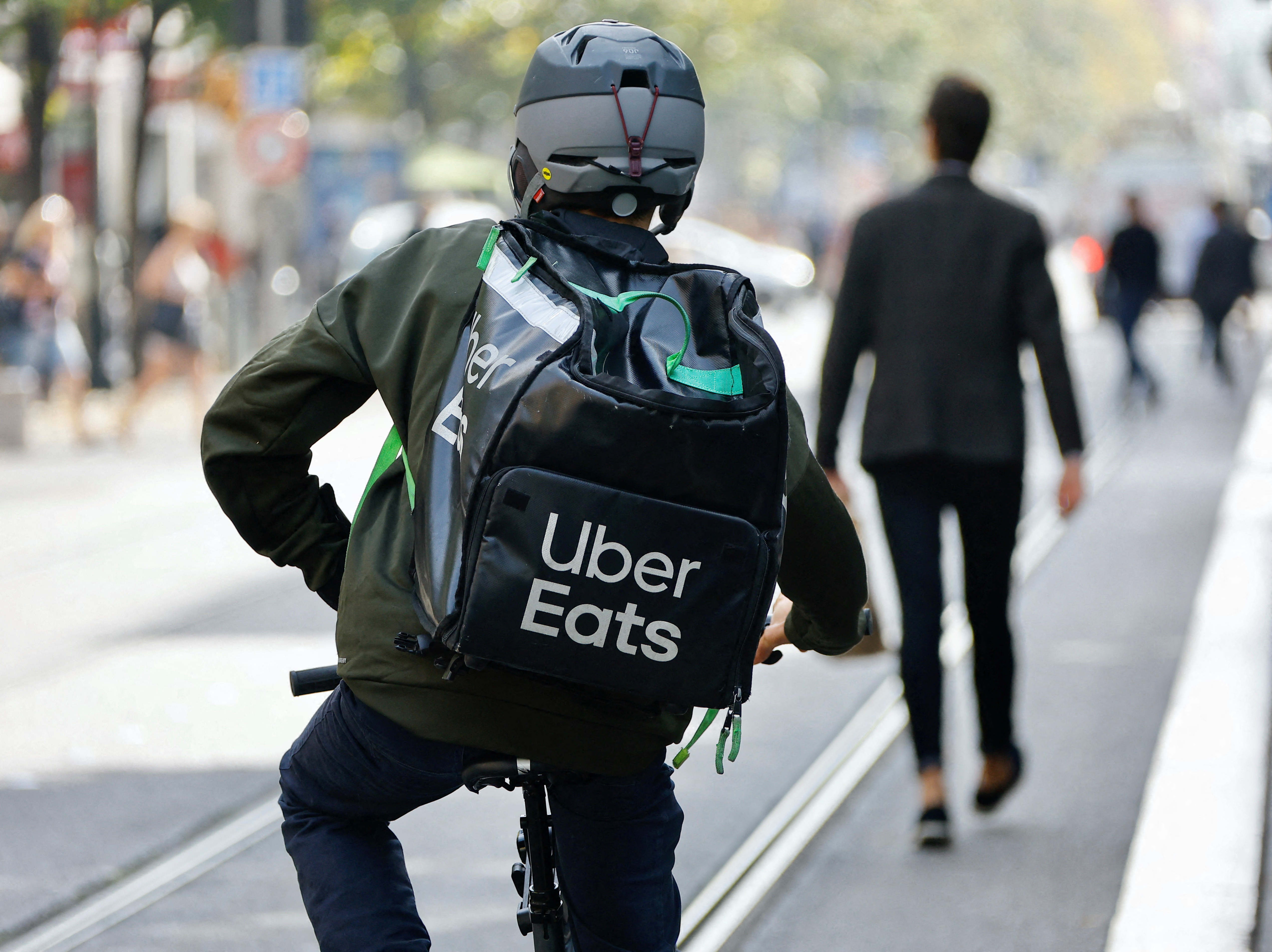 A delivery worker rides a bike in Nice