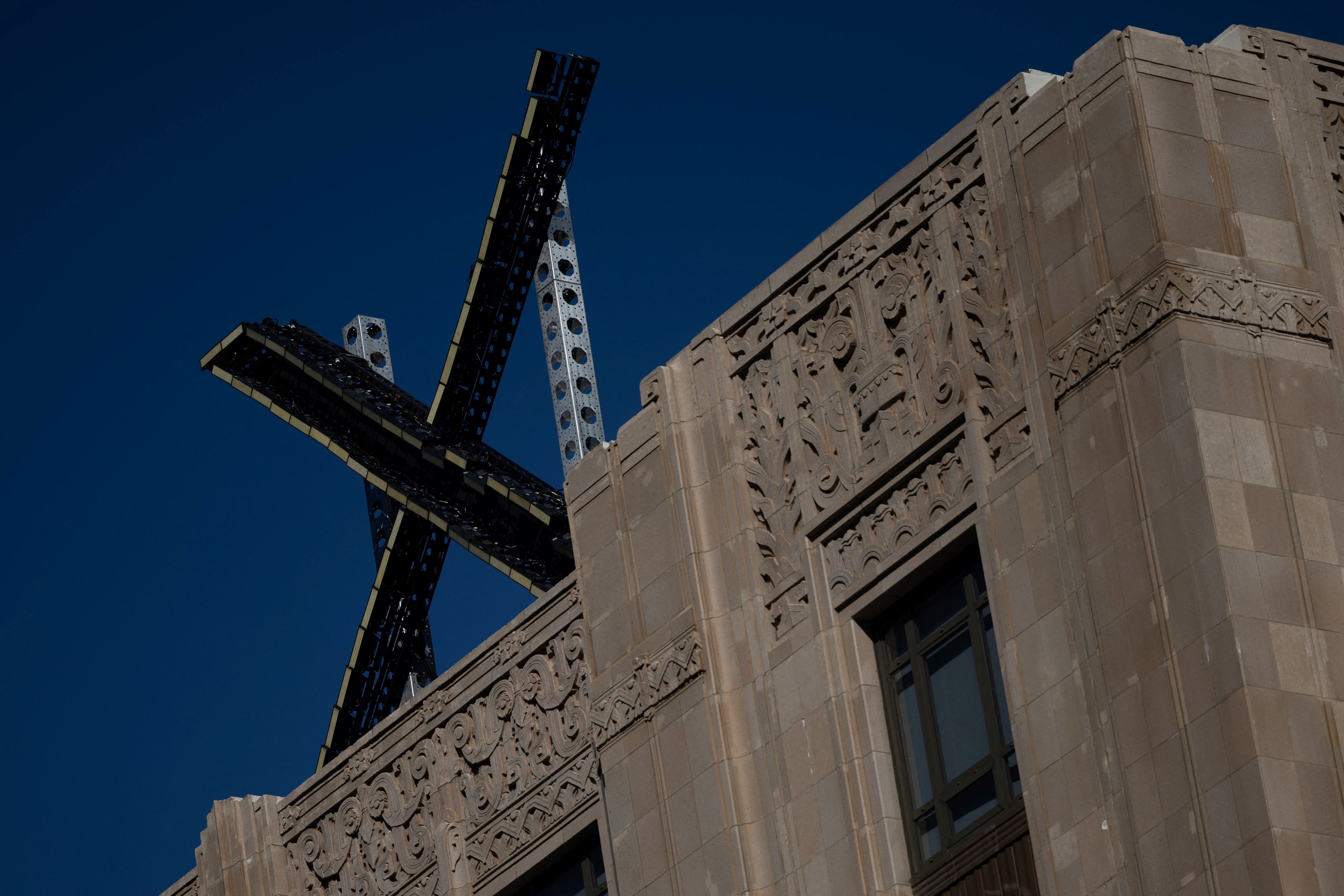 'X' logo is seen on the top of the headquarters of the messaging platform X, formerly known as Twitter in San Francisco