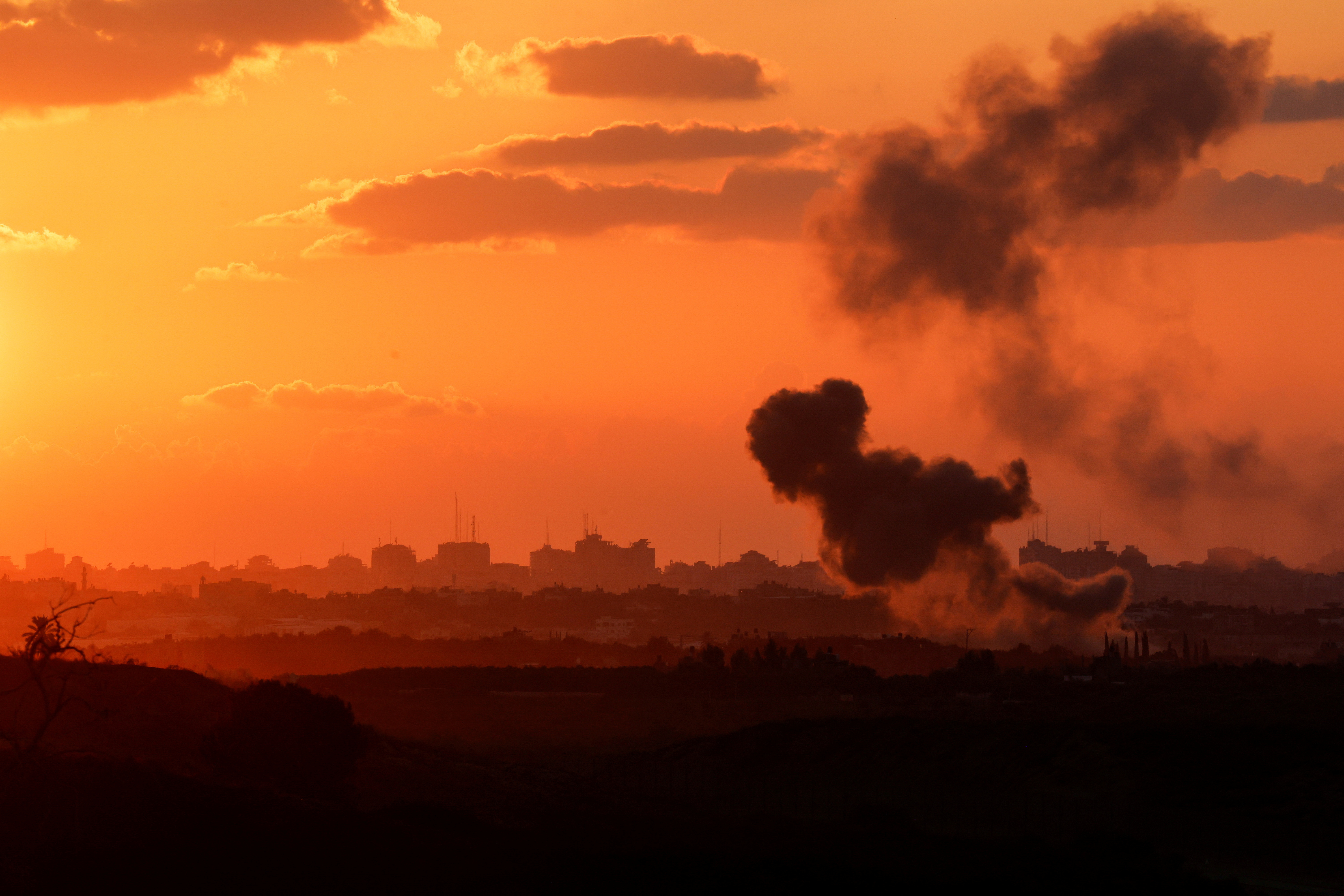 A view shows smoke in the Gaza Strip as seen from Israel's border with the Gaza Strip, in southern Israel