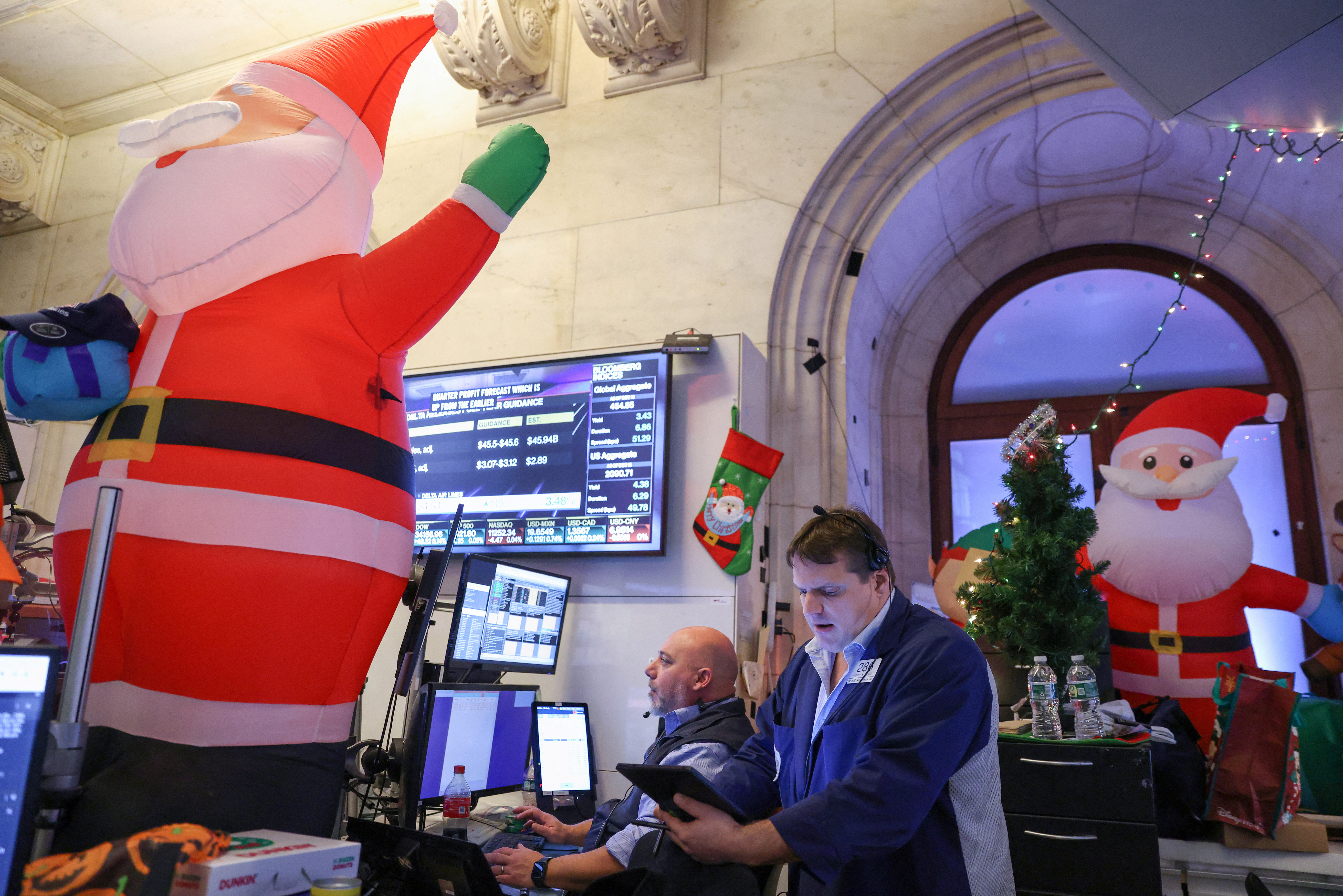 Traders work on the trading floor of the New York Stock Exchange (NYSE) in New York City