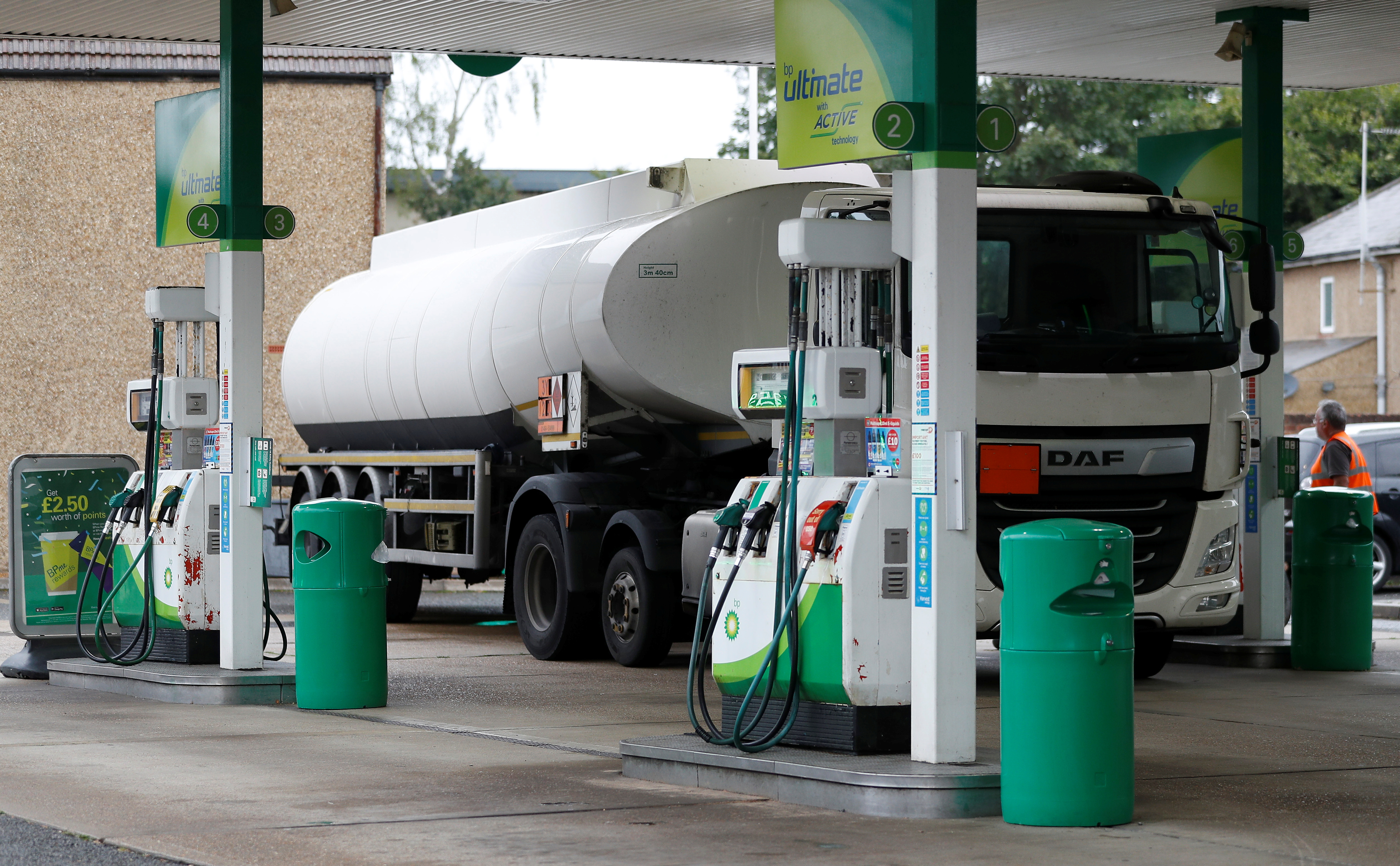 A fuel tanker is parked during a fuel delivery to a BP filling station in Hersham