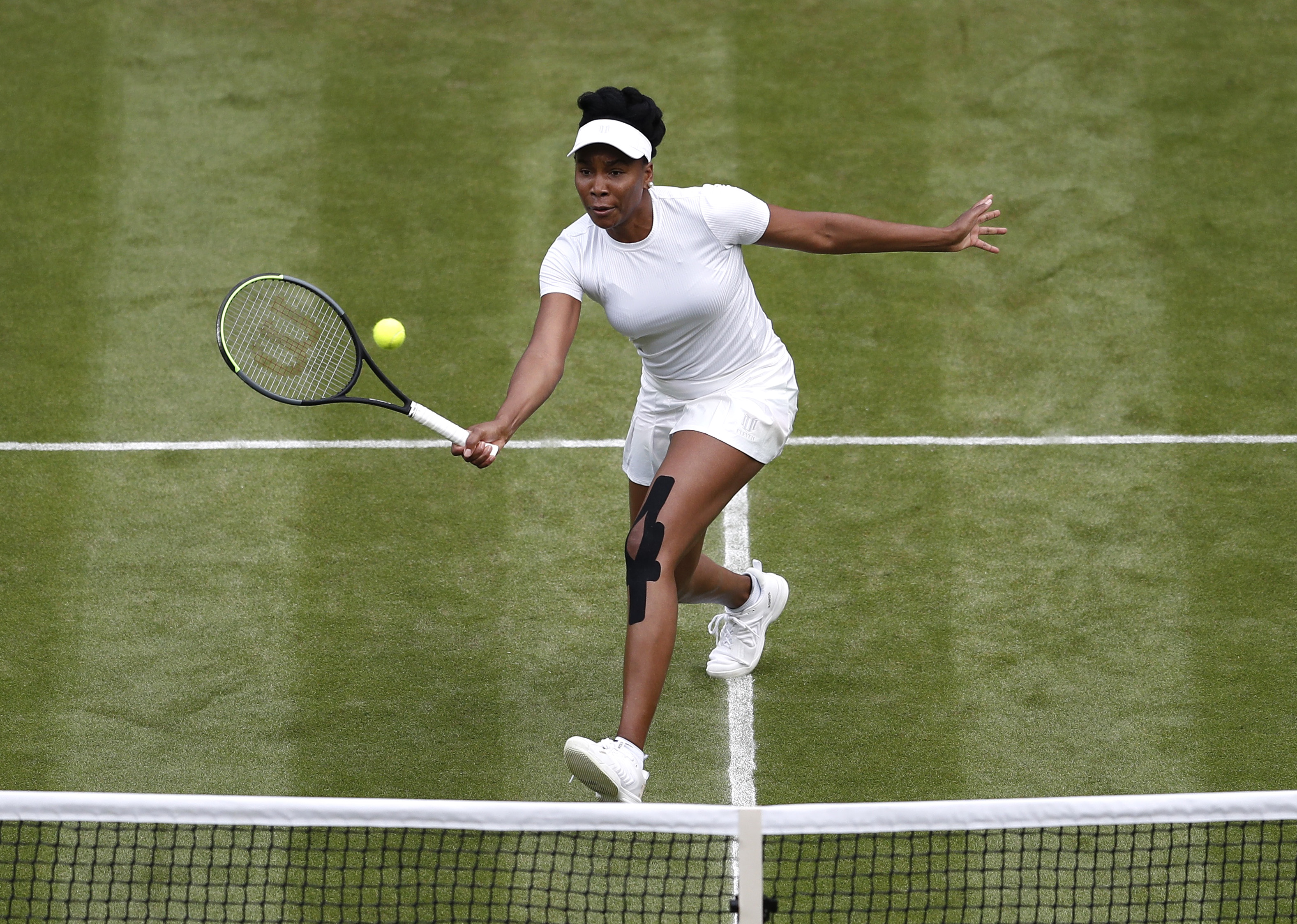Tennis - Wimbledon - All England Lawn Tennis and Croquet Club, London, Britain - June 30, 2021 Venus Williams of the U.S. in action during her second round match against Tunisia's Ons Jabeur