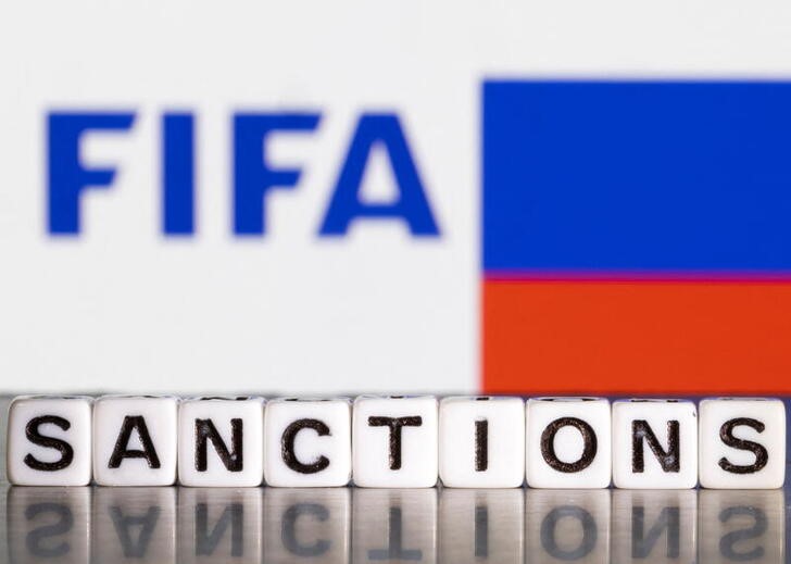 Illustration shows letters arranged to read "Sanctions" in front of FIFA logo and Russian flag colors