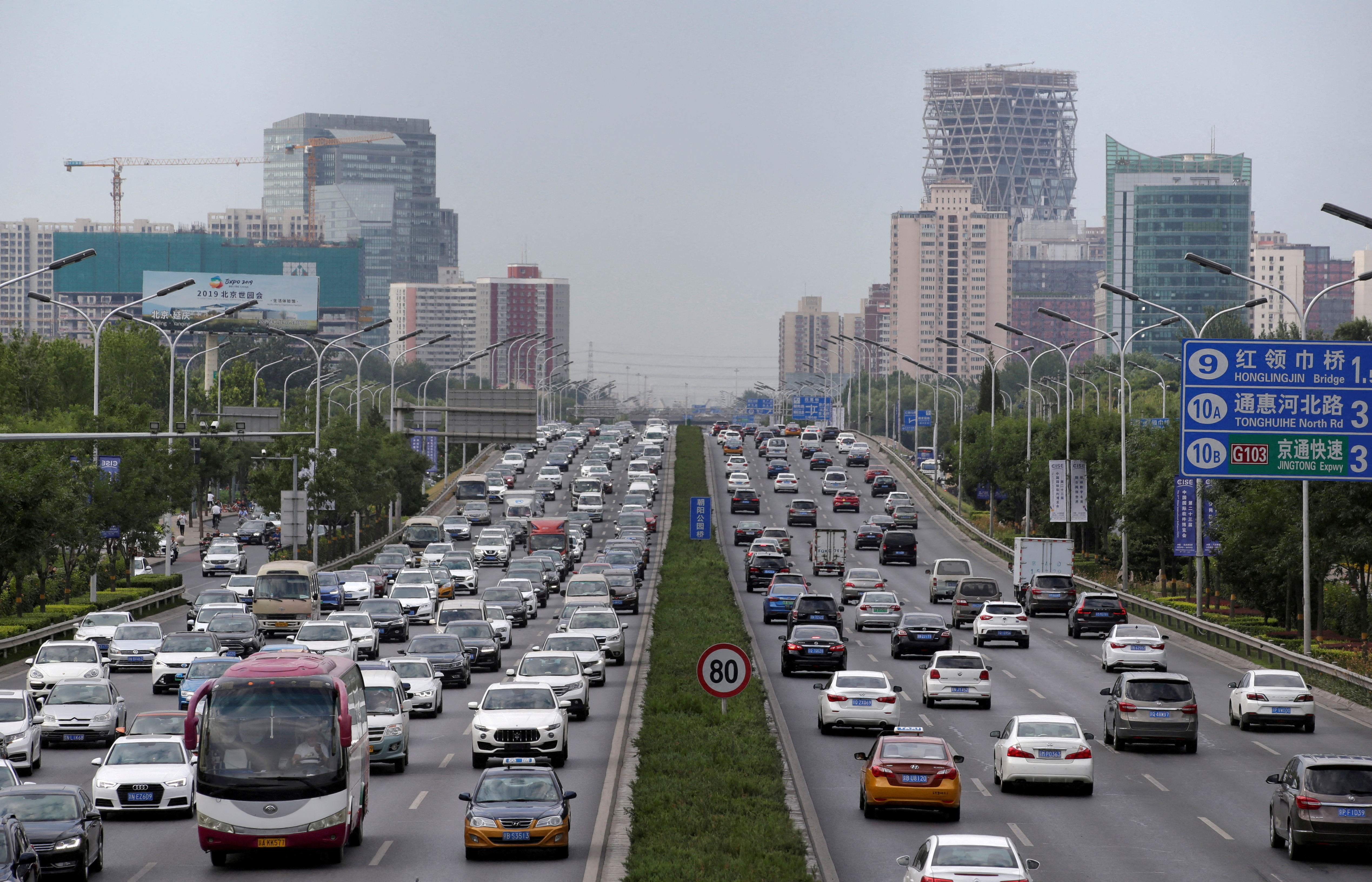 Cars drive on the road during the morning rush hour in Beijing