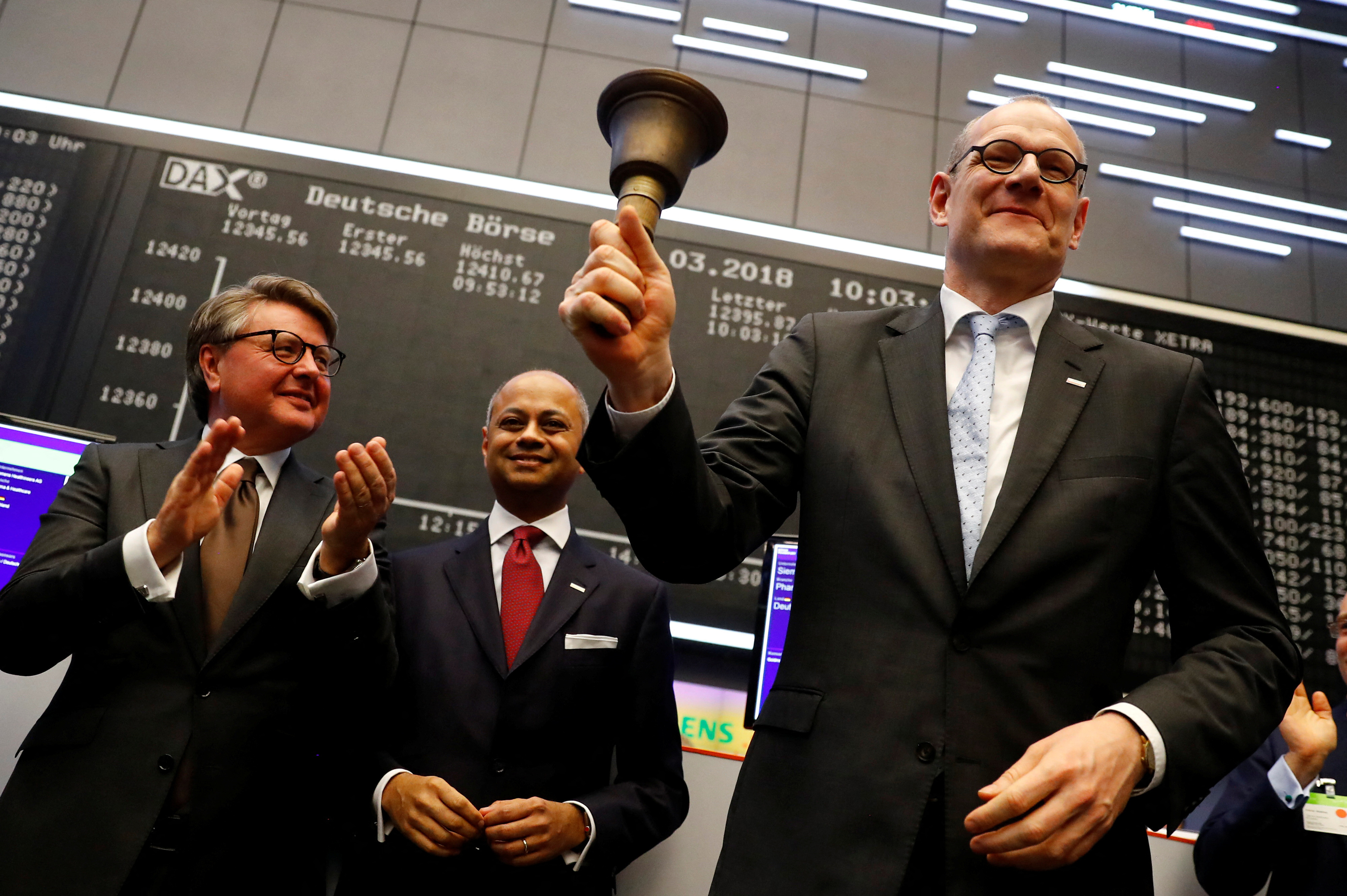 Bernd Montag, CEO of Siemens Healthineers rings the bell for the official share trading start following an initial public offering (IPO) at the trading floor of Frankfurt’s stock exchange in Frankfurt