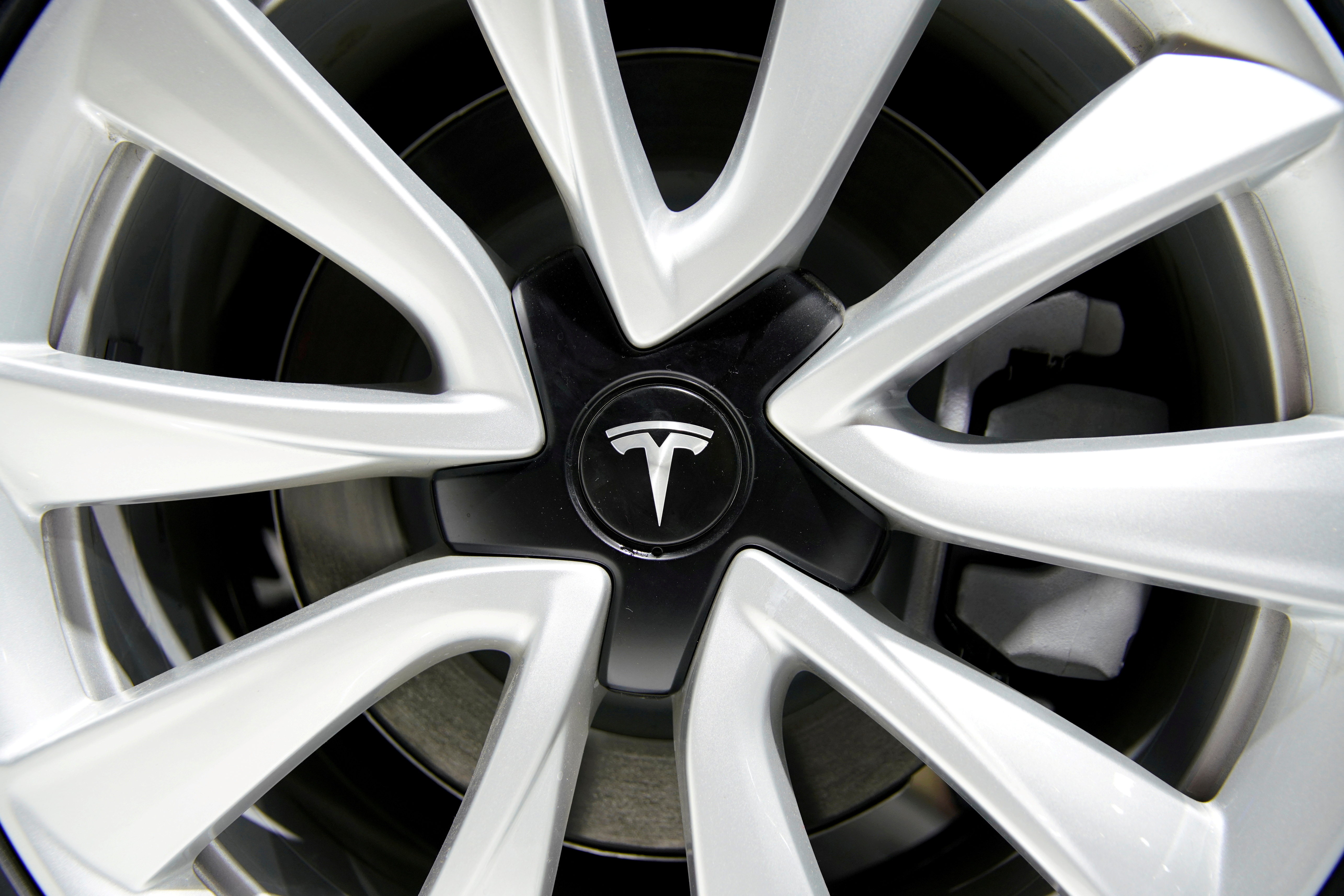 A Tesla logo is seen on a wheel rim during the media day for the Shanghai auto show in Shanghai, China April 16, 2019. REUTERS/Aly Song/File Photo