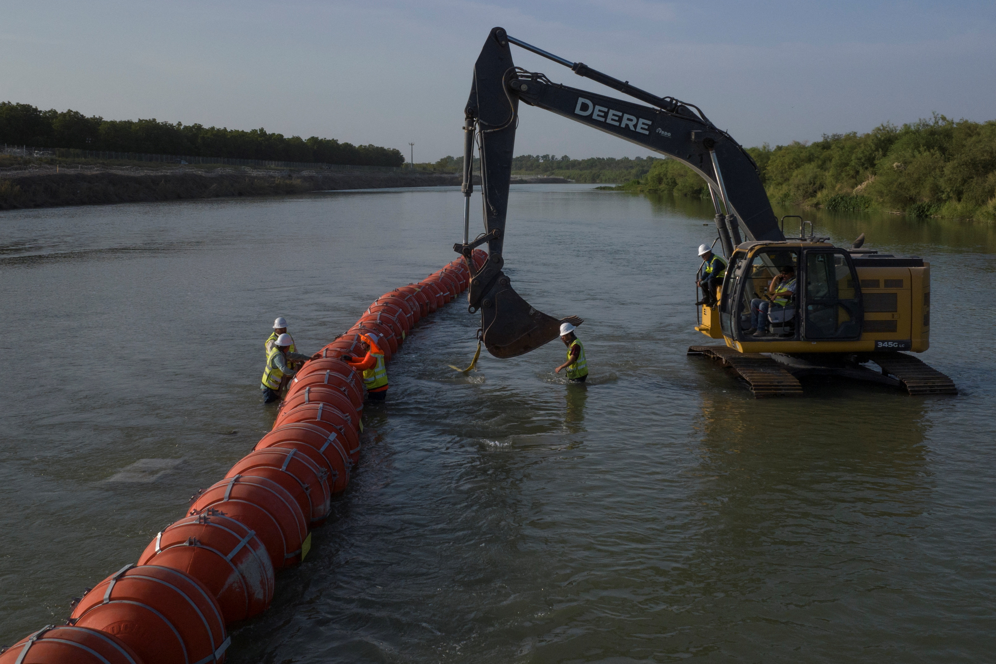 Workers assemble buoys at U.S. Mexico border in Eagle Pass, Texas