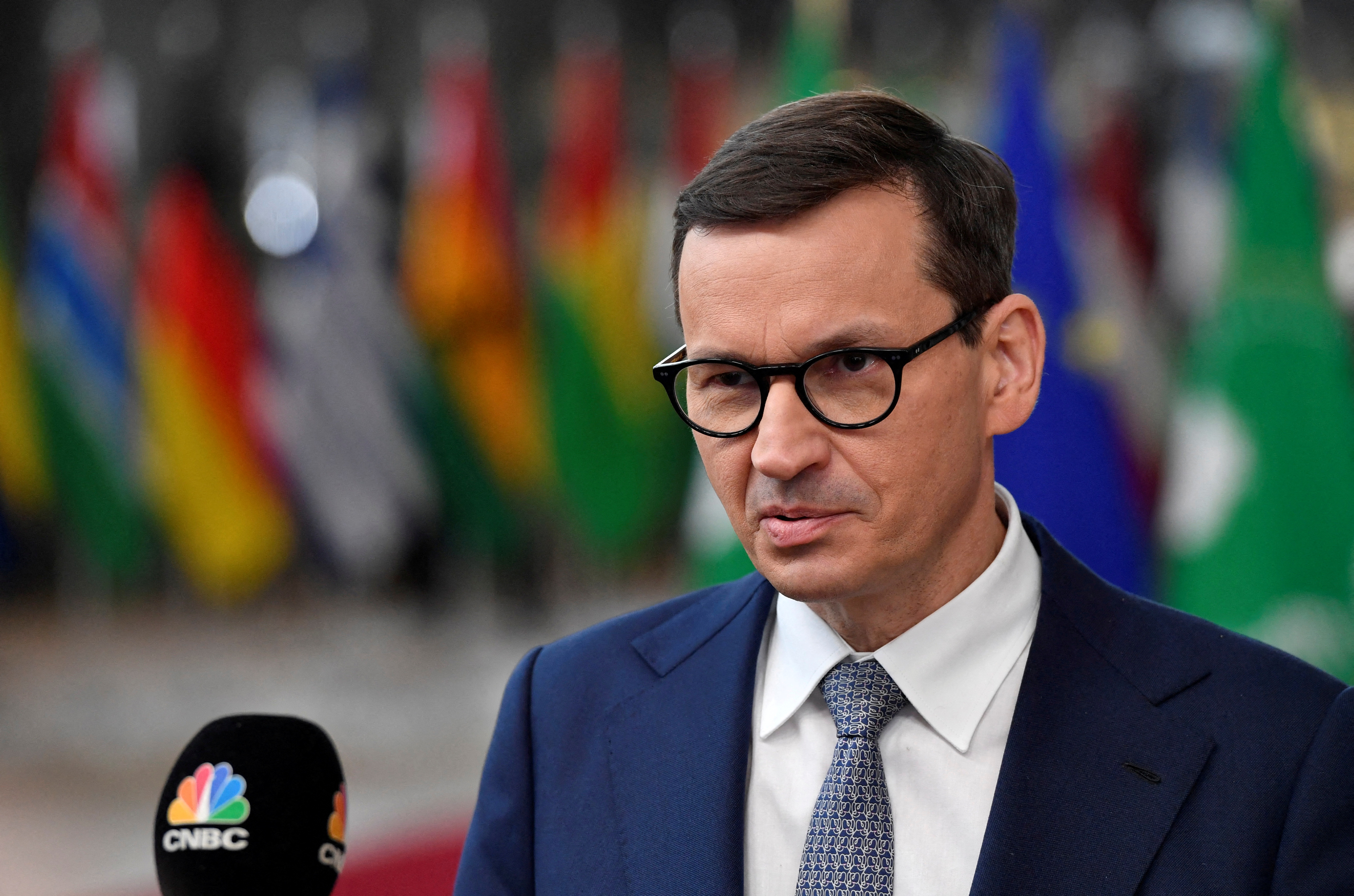 Poland’s Prime Minister Mateusz Morawiecki speaks with the media as he arrives for the EU-Africa summit at the European Council building in Brussels, Belgium February 17, 2022