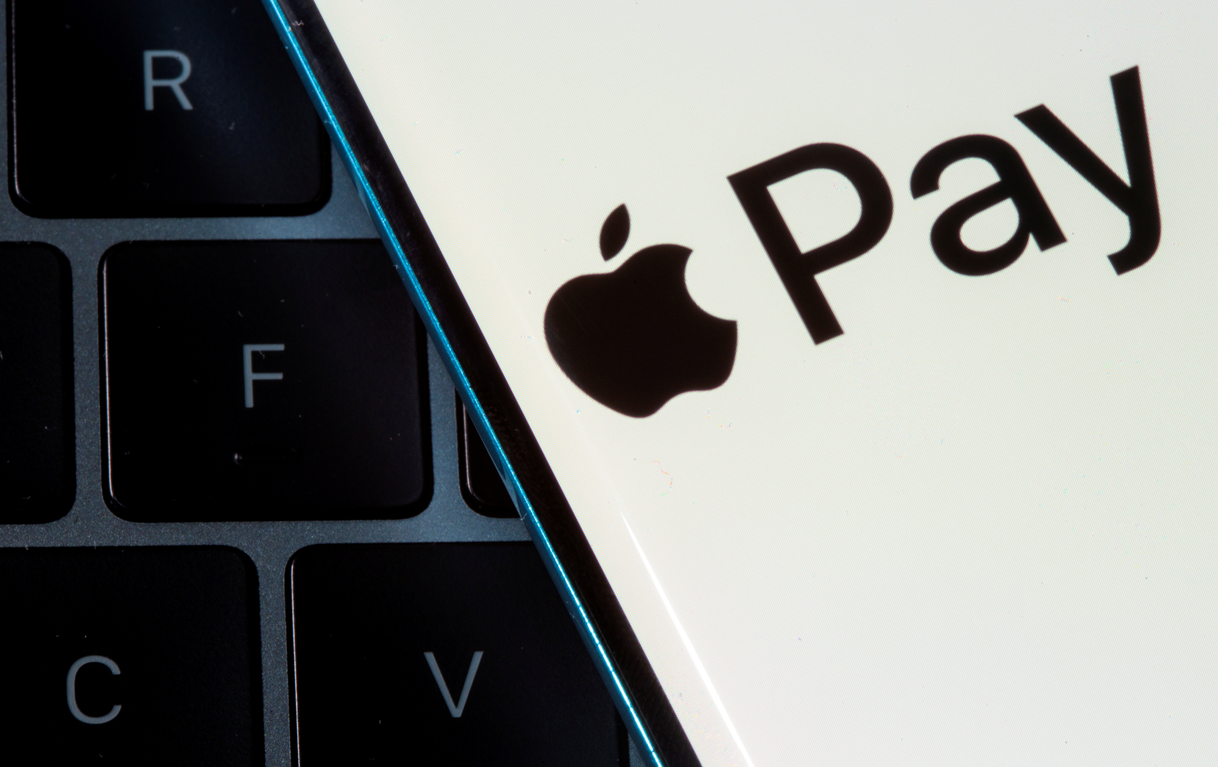 Photo illustration of Apple Pay logo