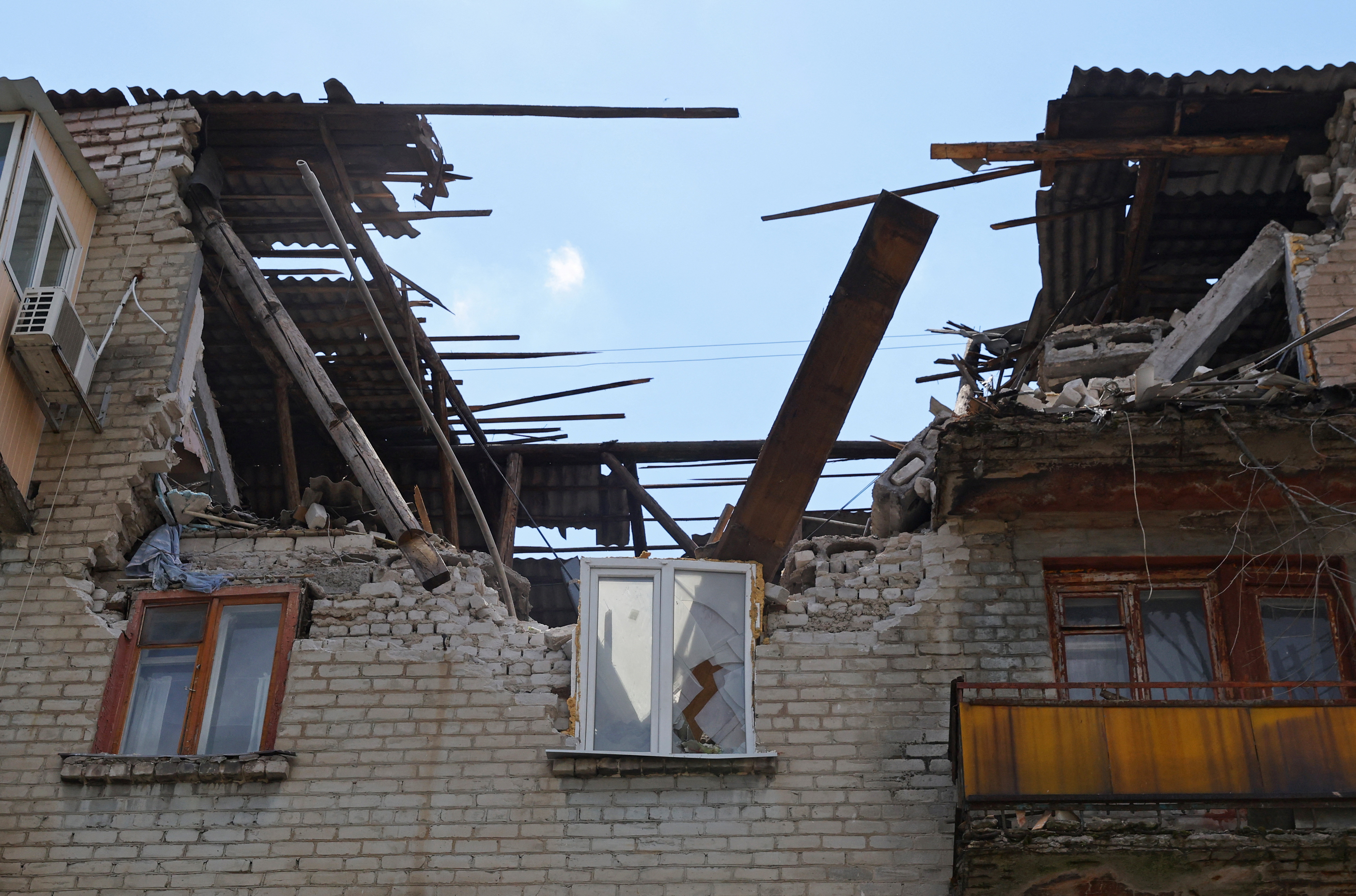 A view shows a damaged apartment building in Lysychansk
