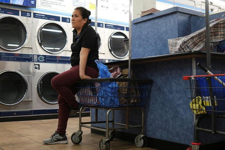 Maria Hernandez, 54, waits at a laundromat in downtown Los Angeles, after her reunification with her daughters in Los Angeles
