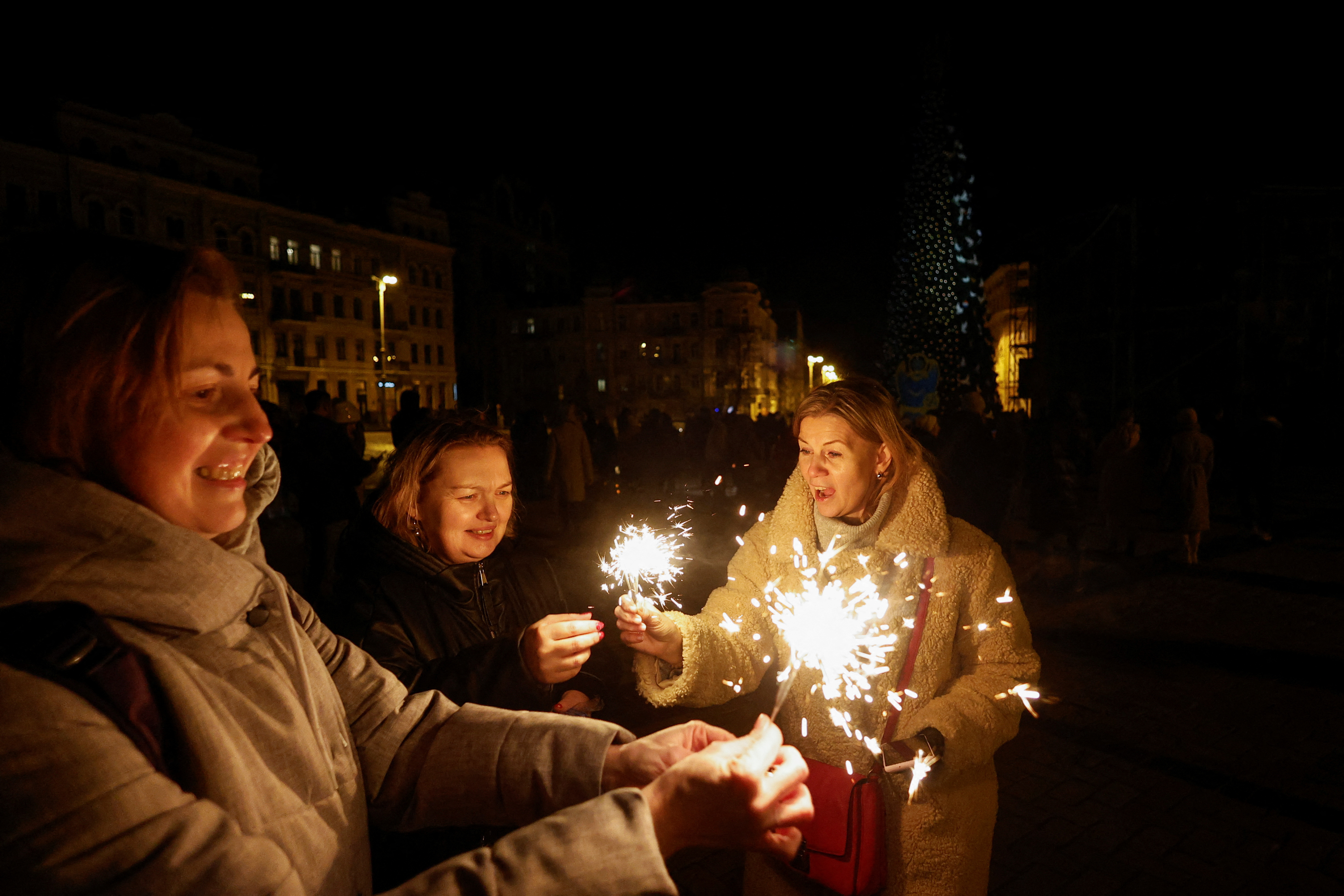 People celebrate New Year's Eve in Kyiv