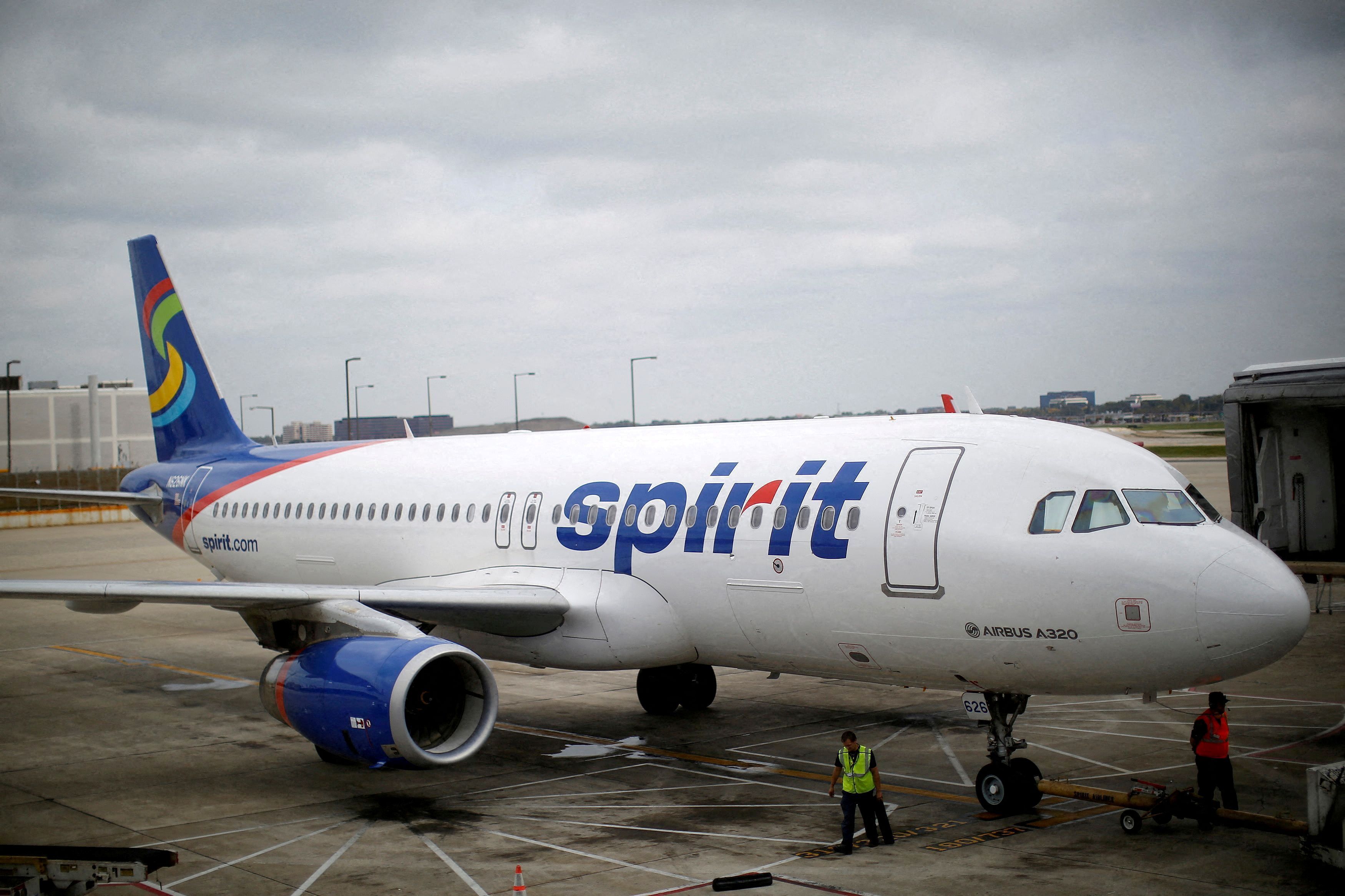 A Spirit Airlines A320-200 airplane sits at a gate at the O'Hare Airport in Chicago, Illinois