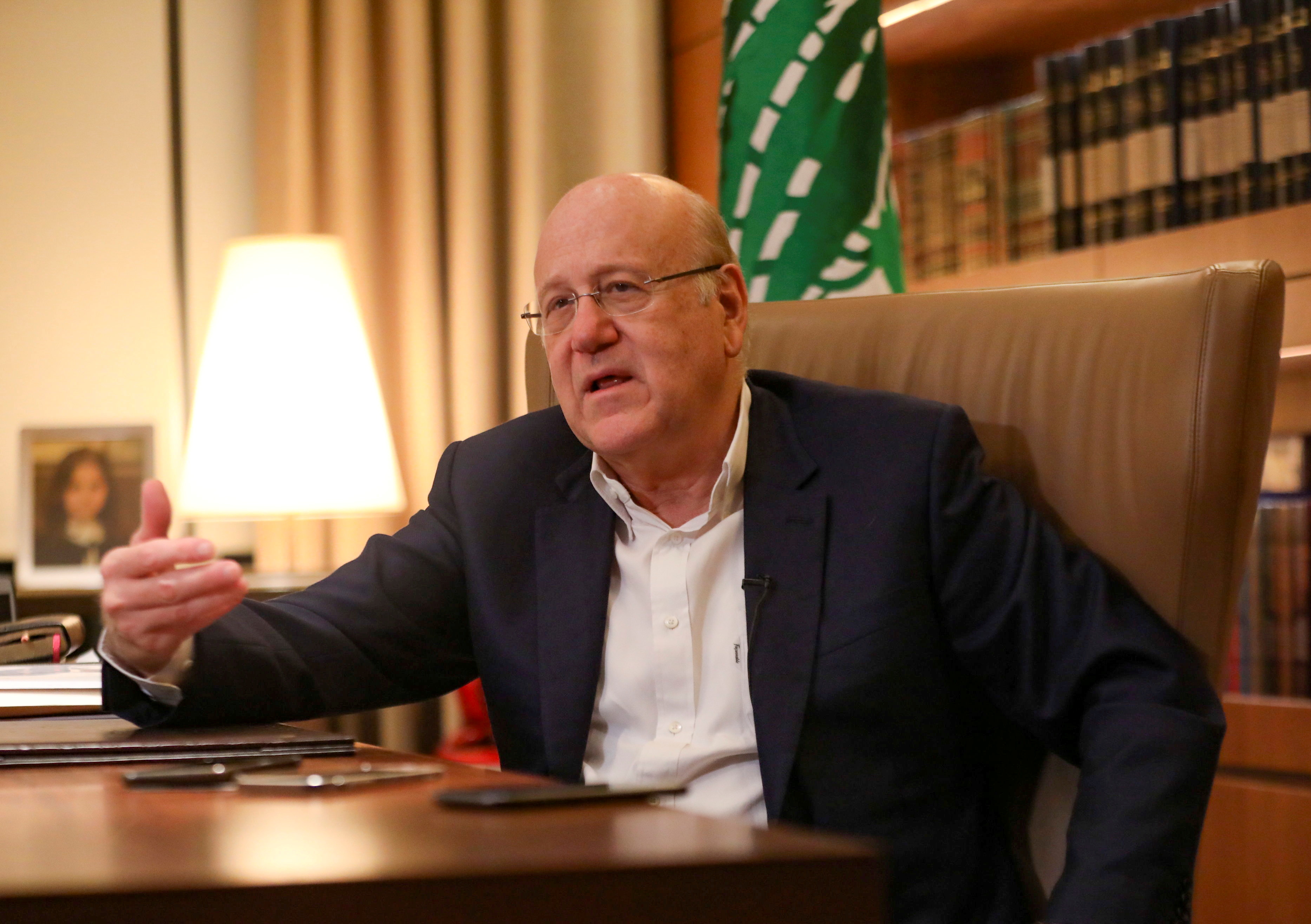 Lebanese Prime Minister Najib Mikati speaks during an interview with Reuters at the government palace in Beirut