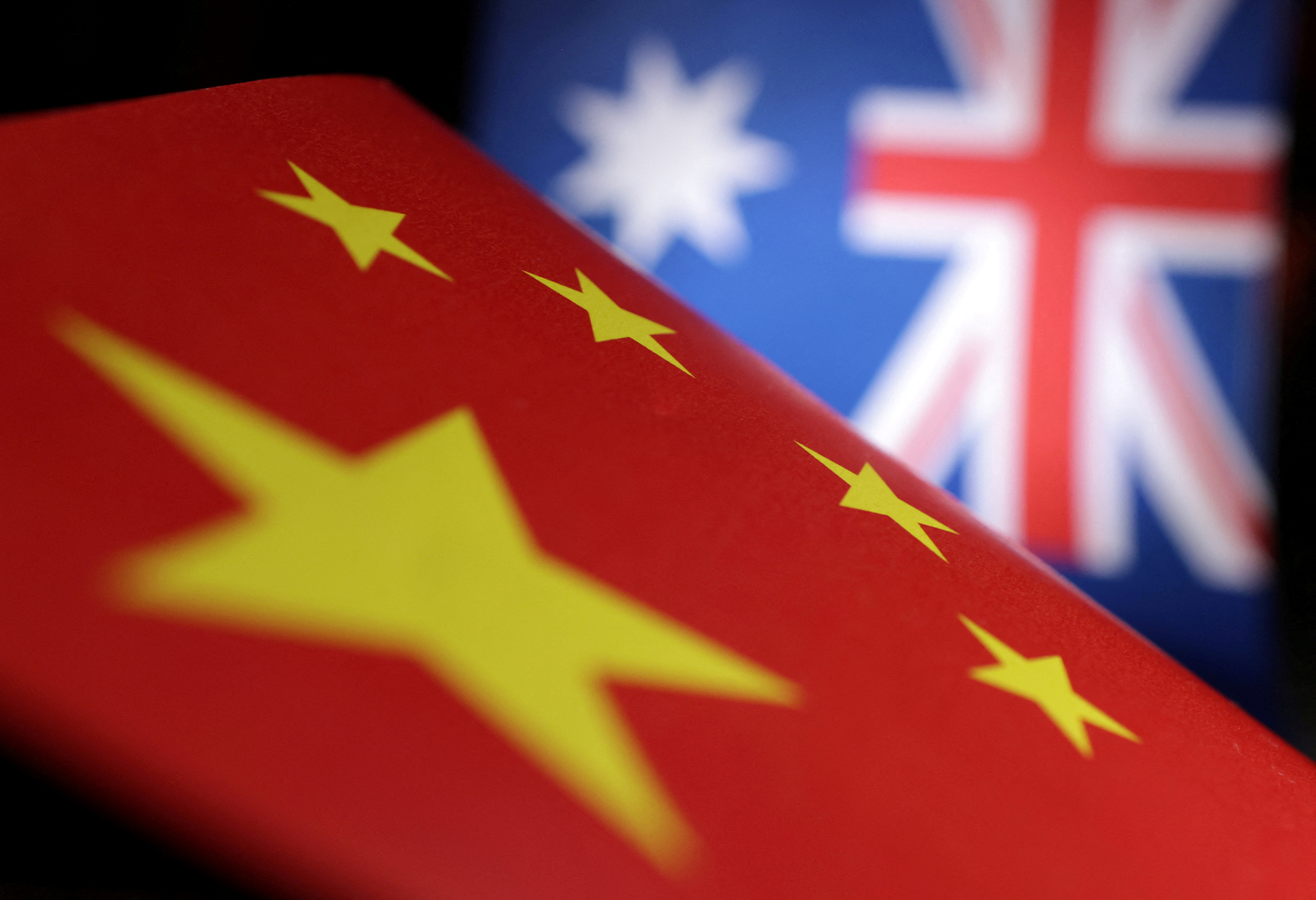 Illustration shows printed Chinese and Australian flags