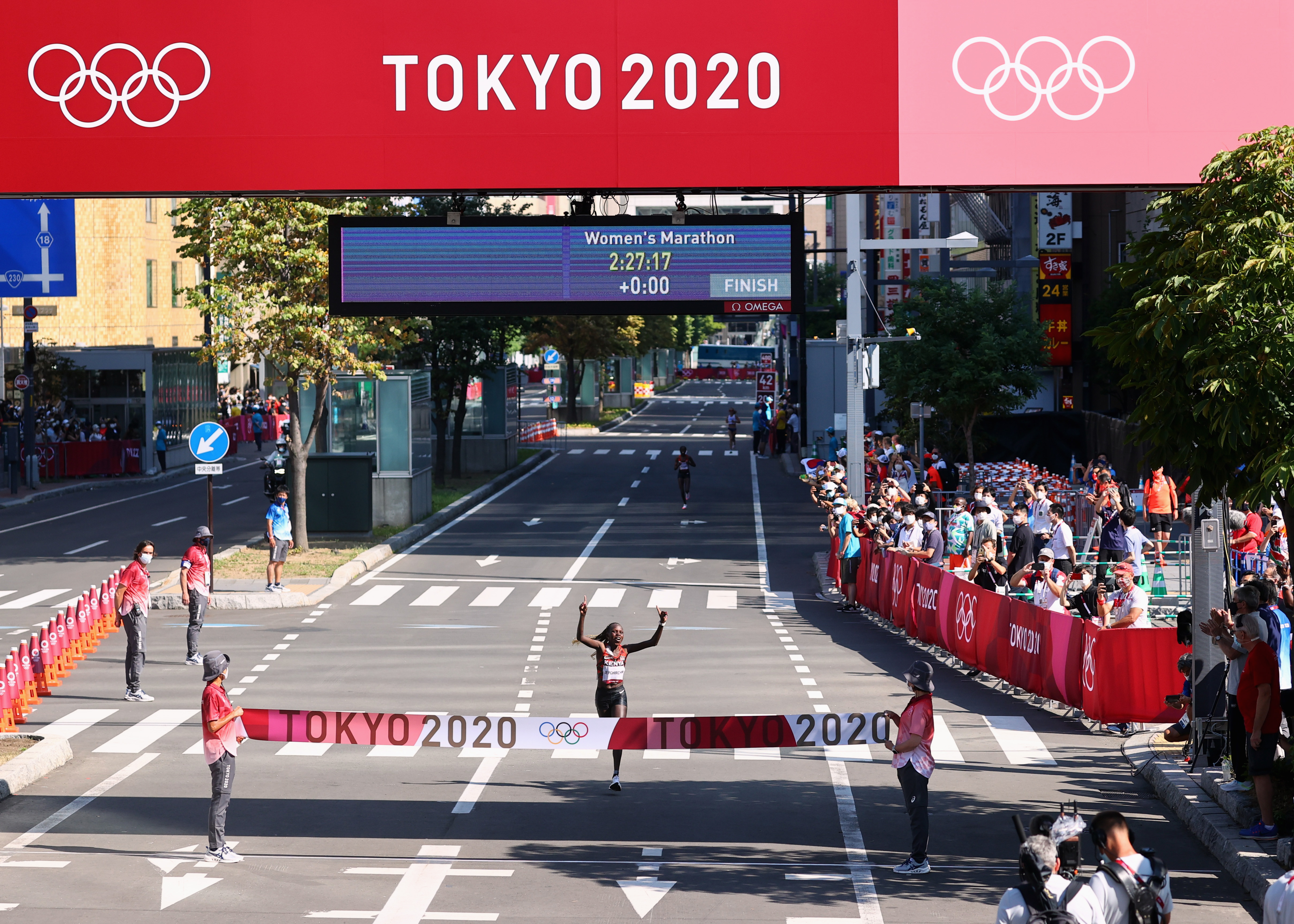 Tokyo 2020 Olympics - Athletics - Women's Marathon - Sapporo Odori Park, Sapporo, Japan - August 7, 2021. Peres Jepchirchir of Kenya celebrates after winning gold REUTERS/Kim Hong-Ji