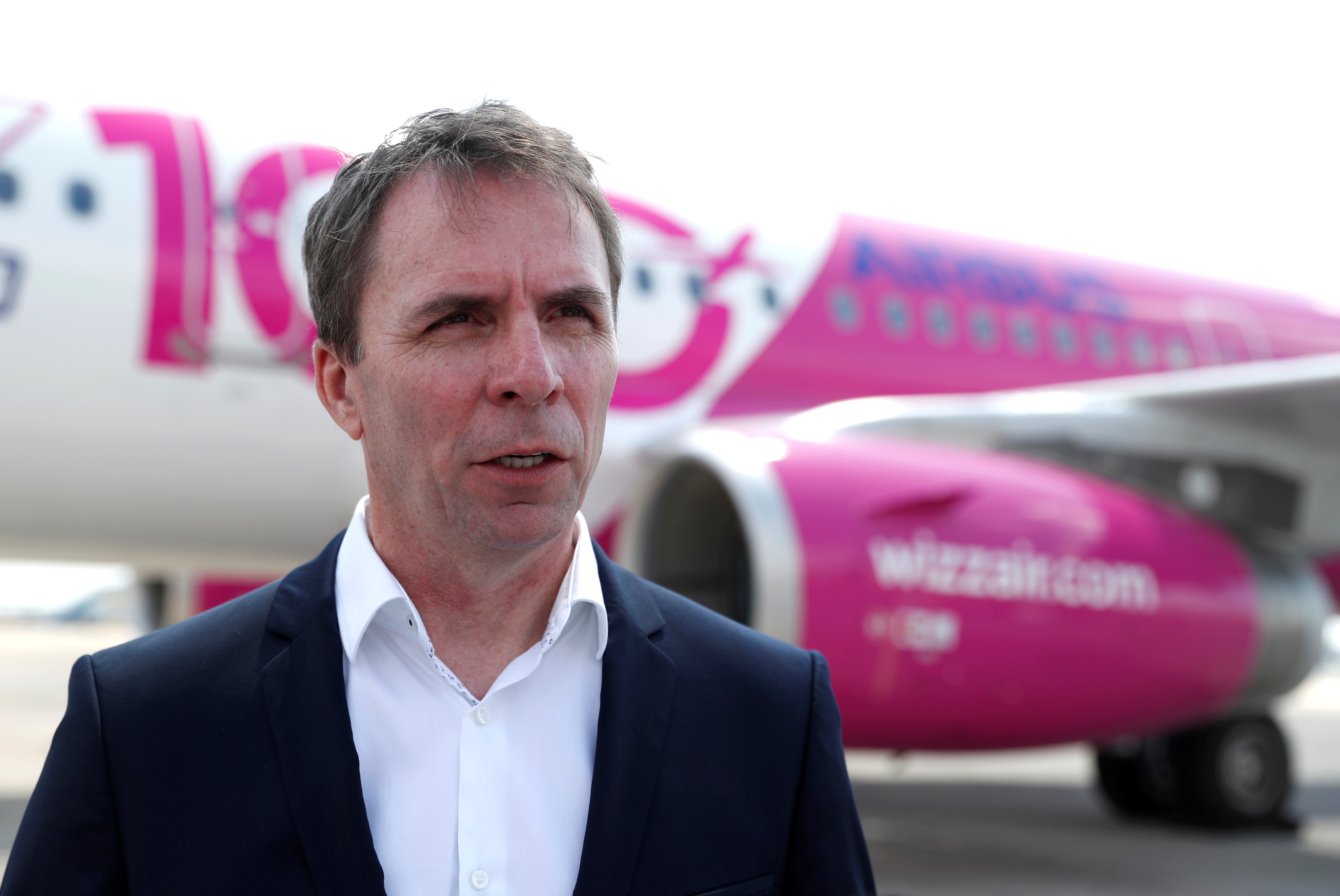CEO of Wizz Air, Jozsef Varadi, speaks during the unveiling ceremony for the airline's 100th plane