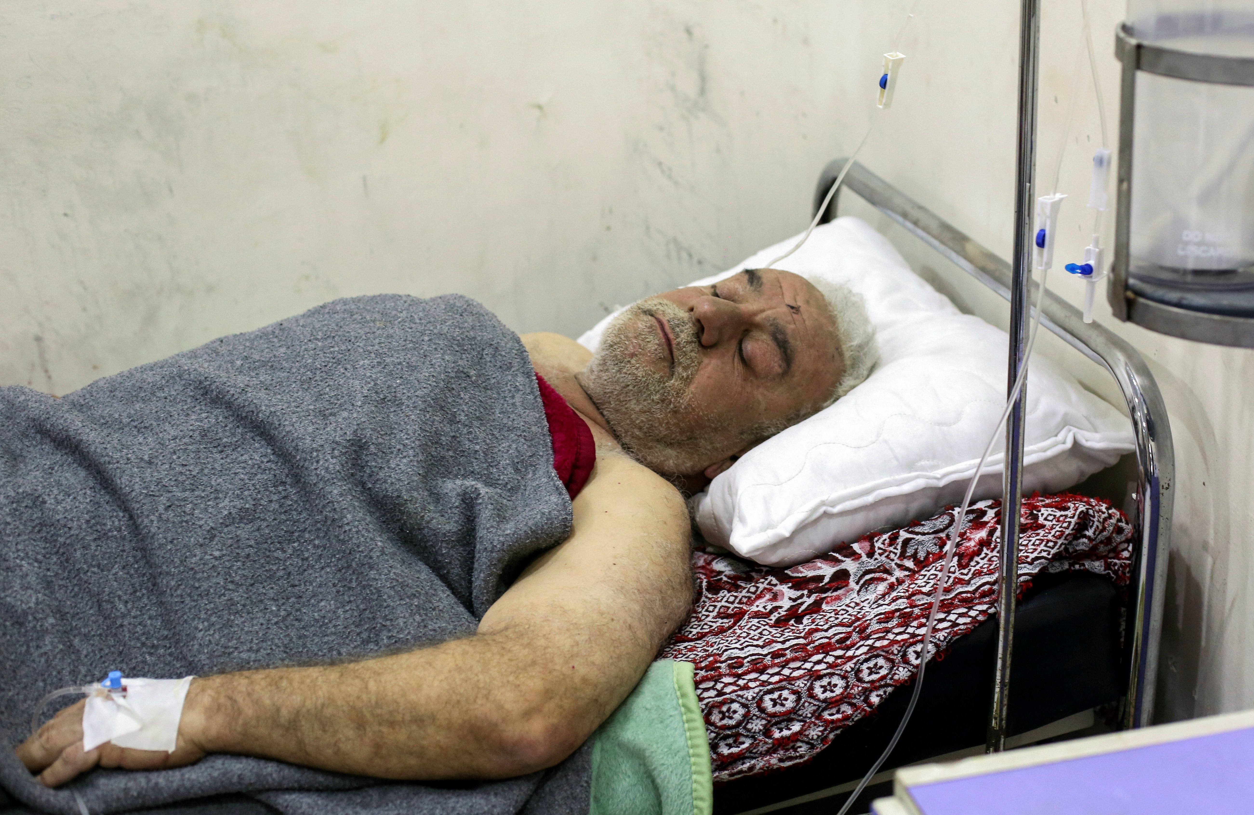 Syrian earthquake survivor, Nuhad Dawoud, lies in a hospital bed in the Syrian coastal city of Latakia