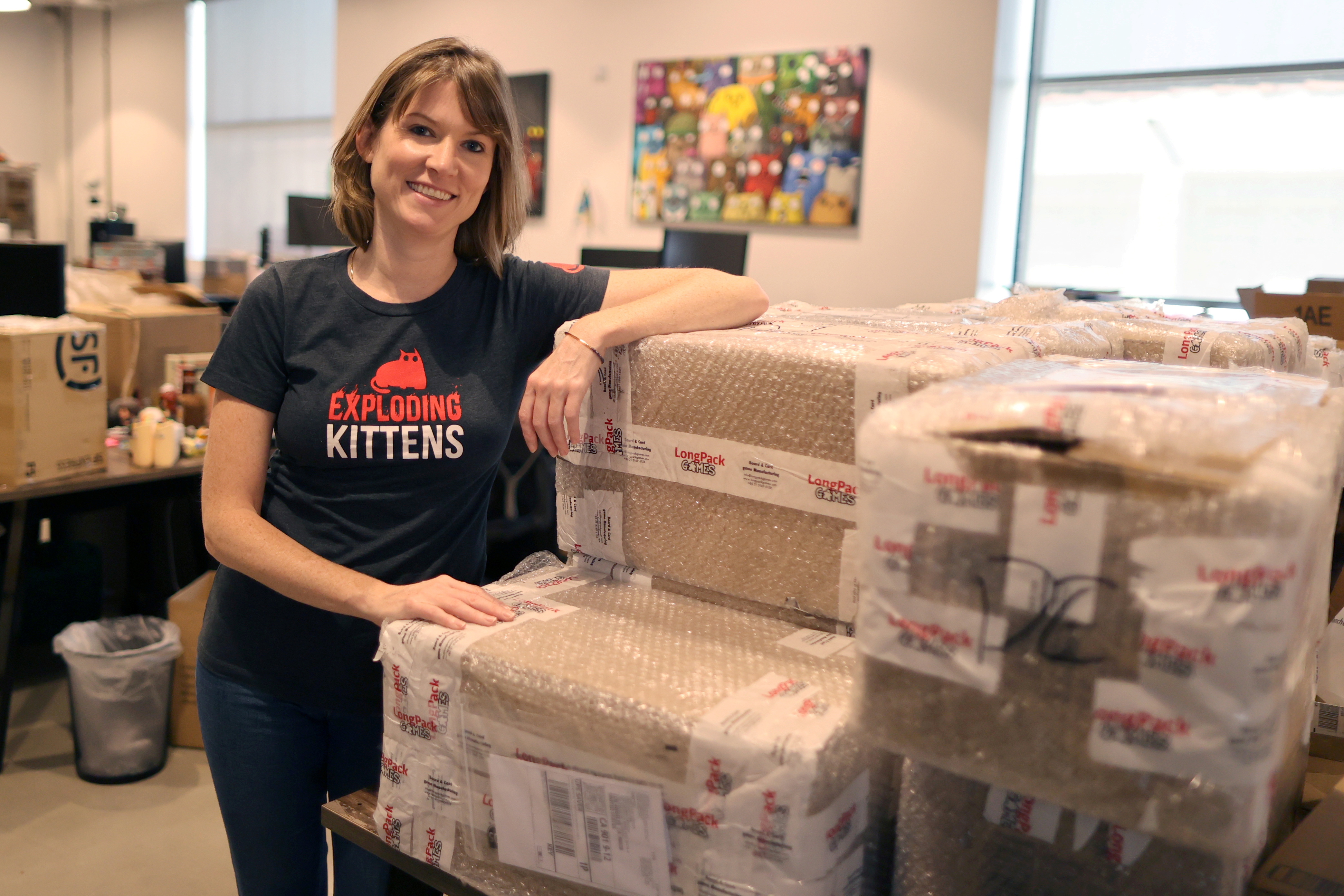 Carly McGinnis, Chief Operating Officer at Exploding Kittens, a Los Angeles-based board game company, poses for a photo at the company's office in Los Angeles