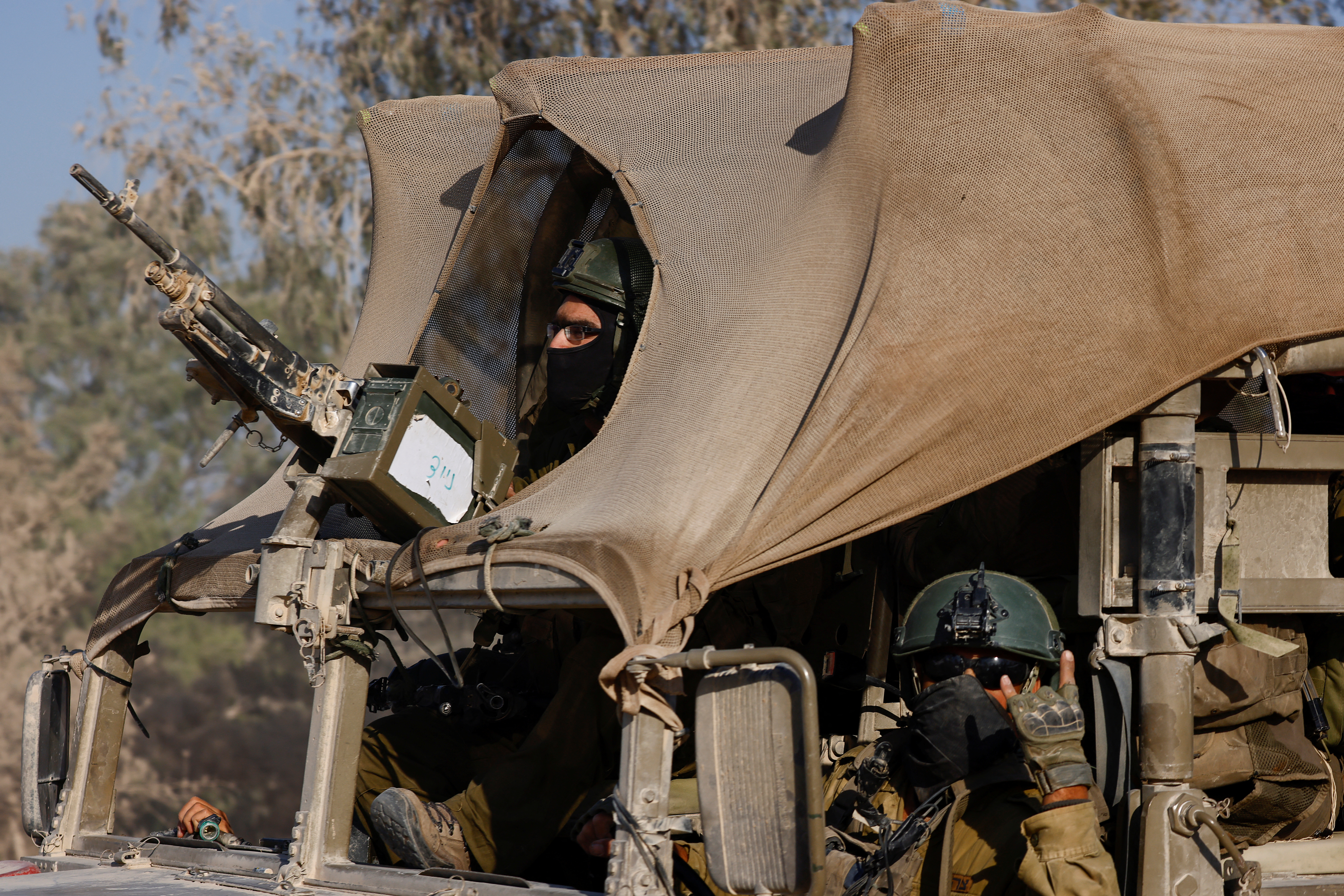 Israeli military vehicle manoeuvres, amid the Israel-Hamas conflict, near the Israel-Gaza border