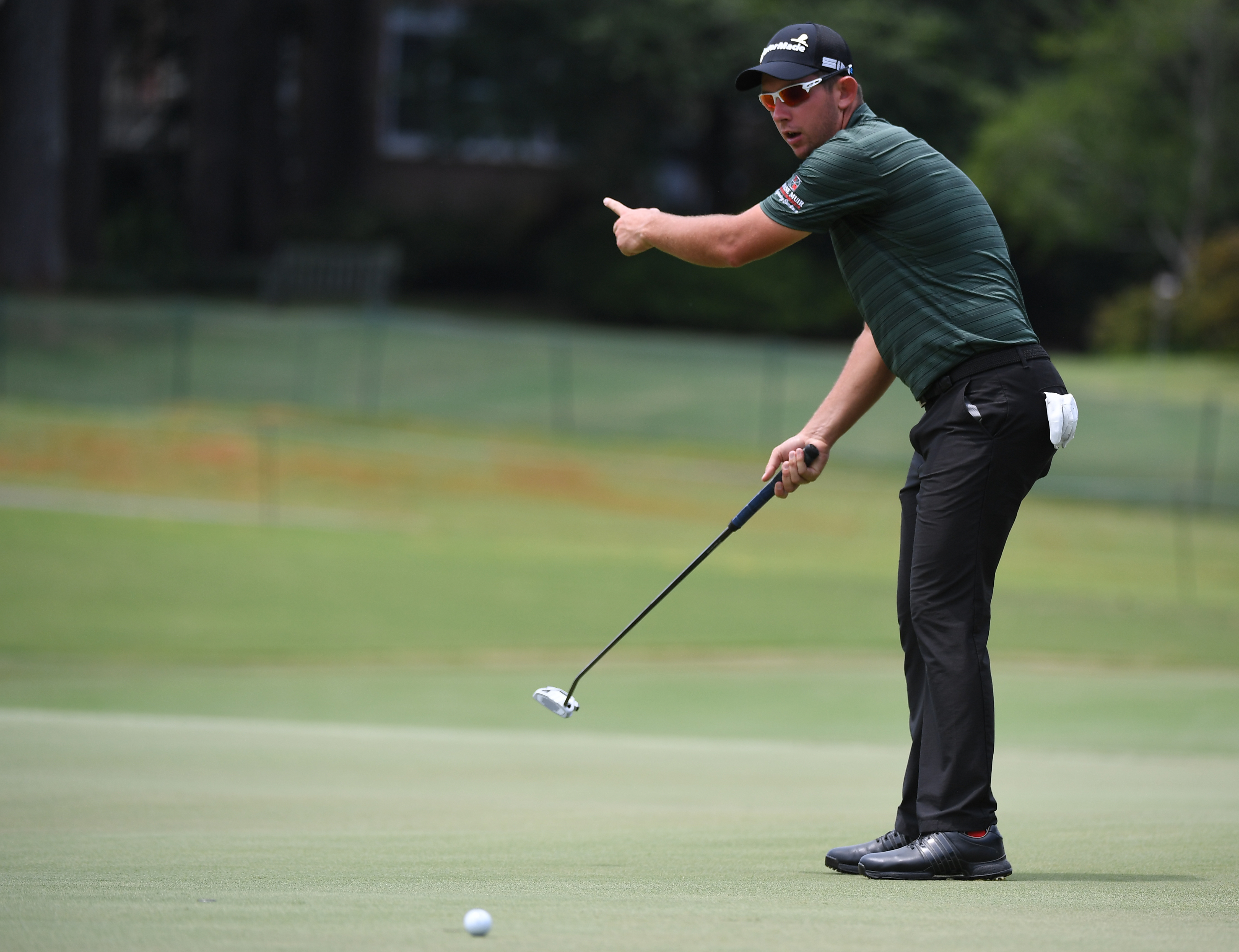 Aug 5, 2021; Memphis, Tennessee, USA; Lucas Herbert reacts to missing a putt on the 13th hole during the first round of the WGC FedEx St. Jude Invitational golf tournament at TPC Southwind. Mandatory Credit: Christopher Hanewinckel-USA TODAY Sports
