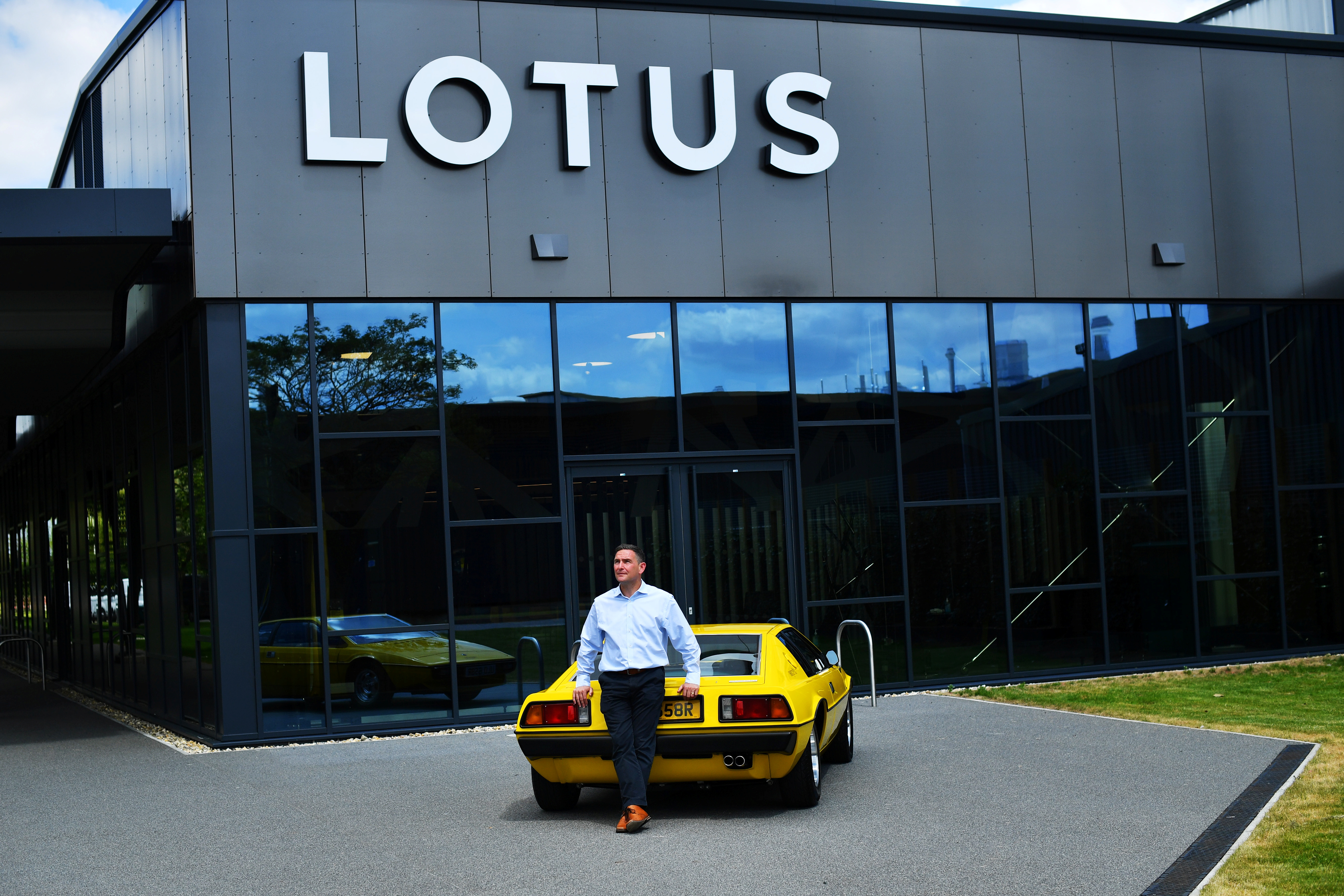 Managing Director of Lotus, Matt Windle stands with a Lotus Esprit car at the company's plant in Hethel