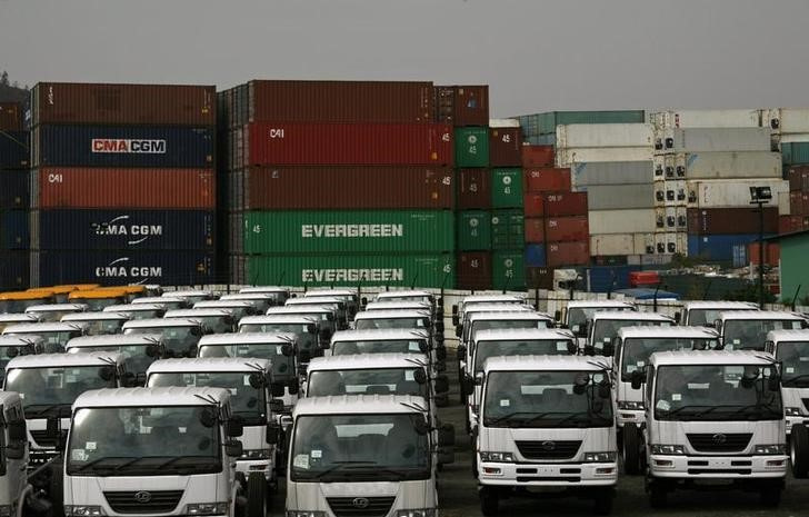 New container trucks are parked in front of a container storage depot in north-west Hong Kong