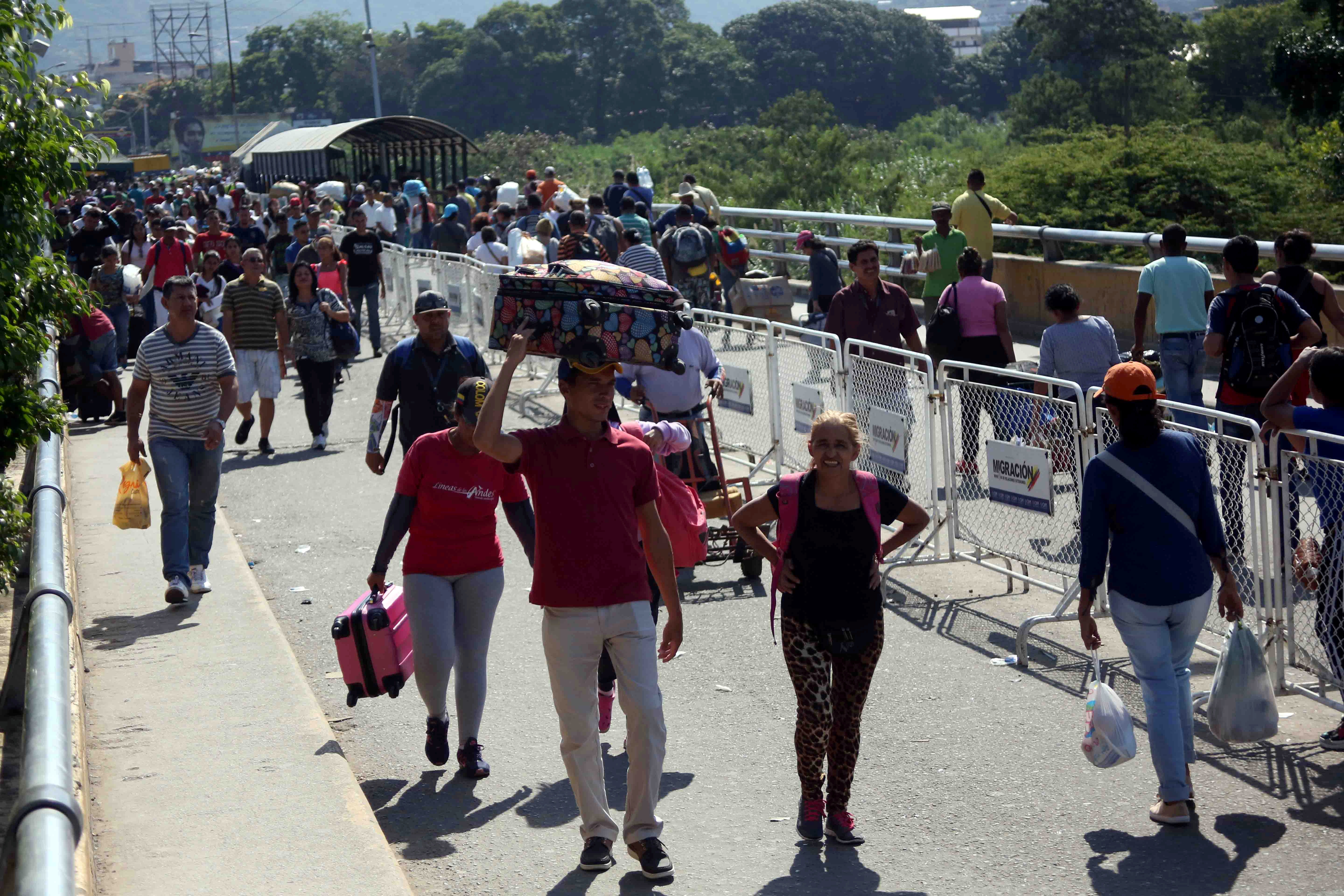 People walk across Simon Bolivar bridge at the border with Venezuela in Cucuta
