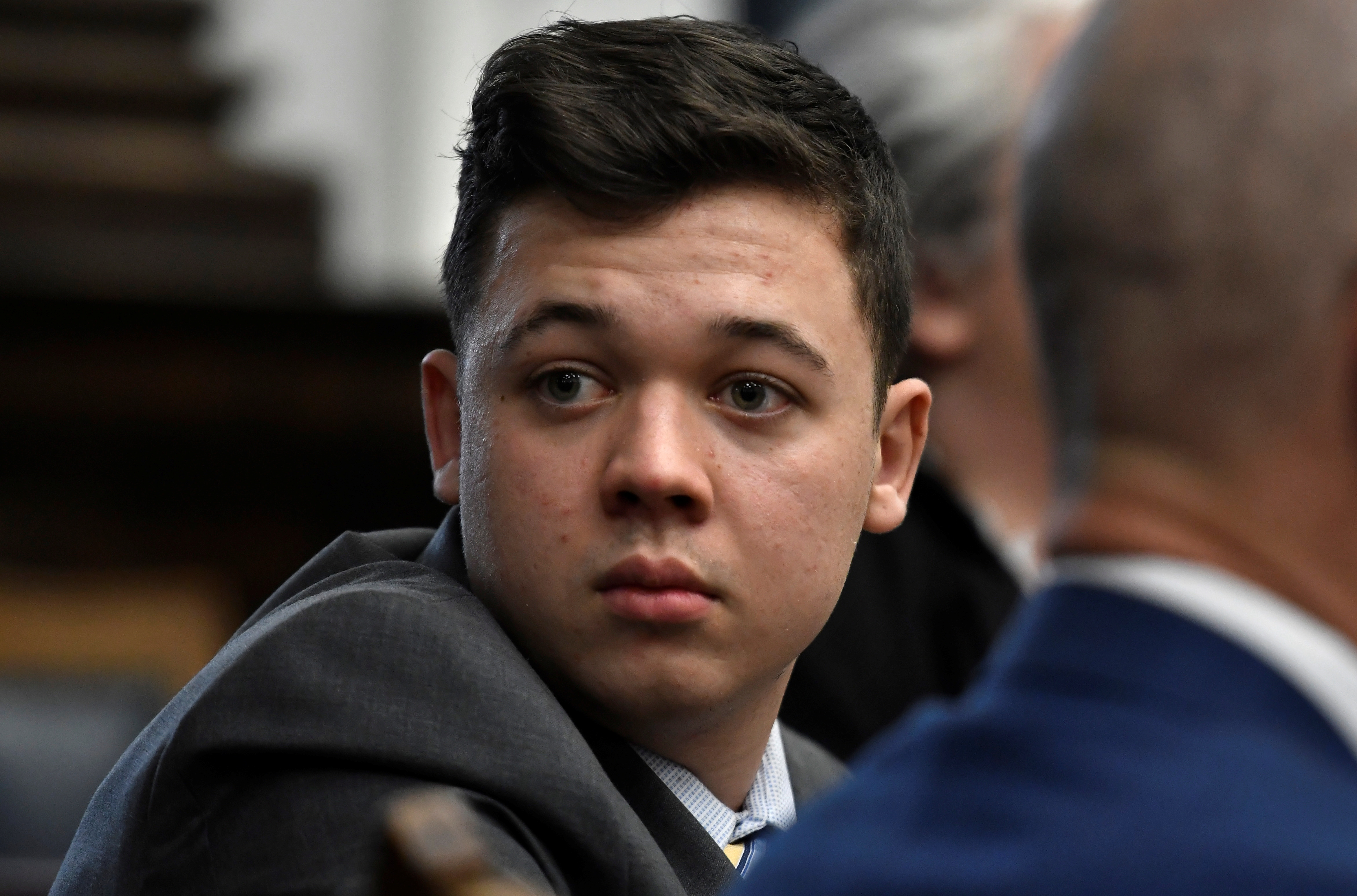 Kyle Rittenhouse looks back as attorneys discuss items in the motion for mistrial presented by his defense at the Kenosha County Courthouse in Kenosha, Wisconsin, U.S., November 17, 2021. Sean Krajacic/Pool via REUTERS