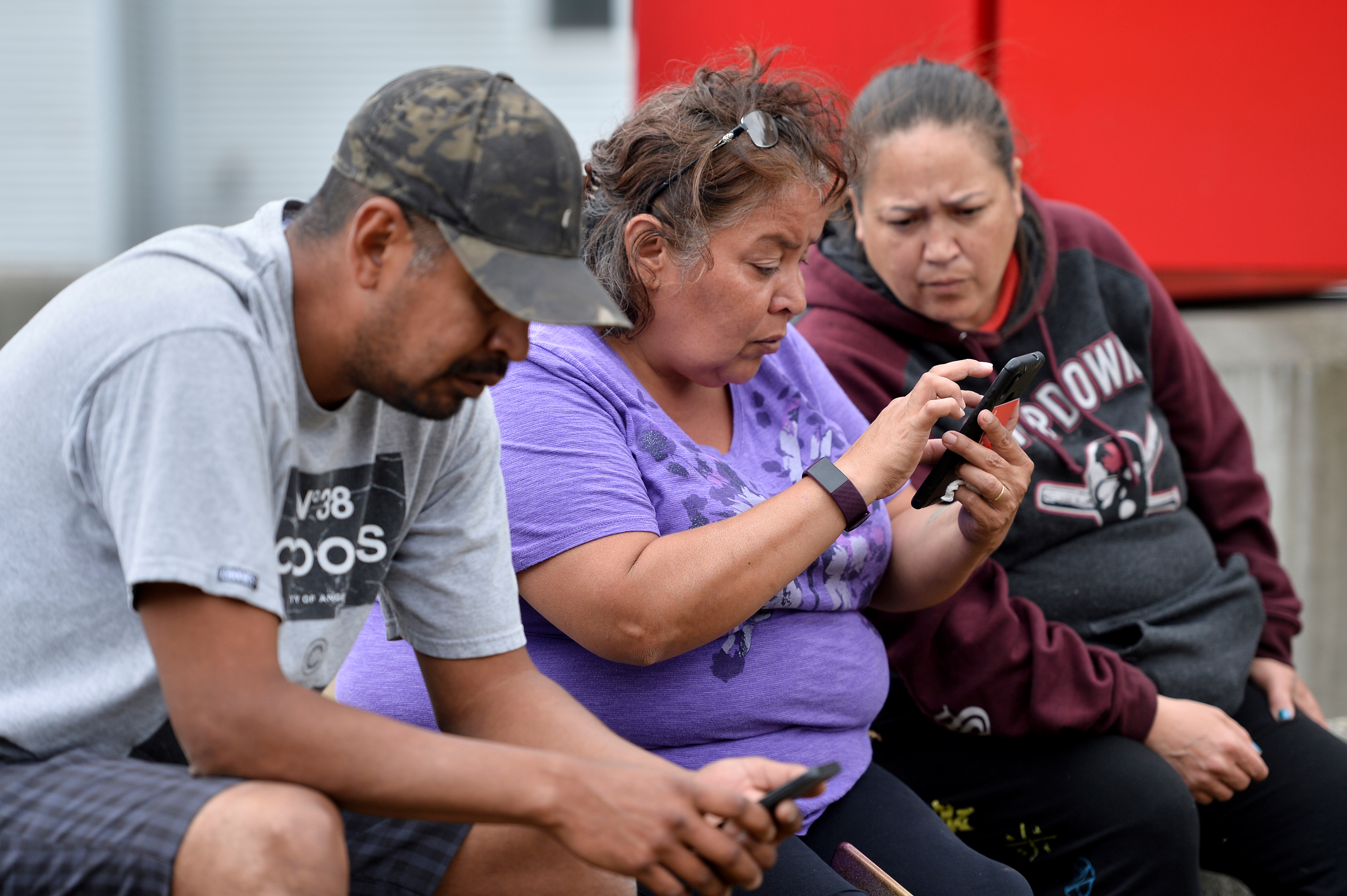 Kasey Johnny awaits news of family members after a wildfire that raged through the town of Lytton forced residents to evacuate, in nearby Boothroyd, British Columbia, Canada July 1, 2021.  REUTERS/Jennifer Gauthier