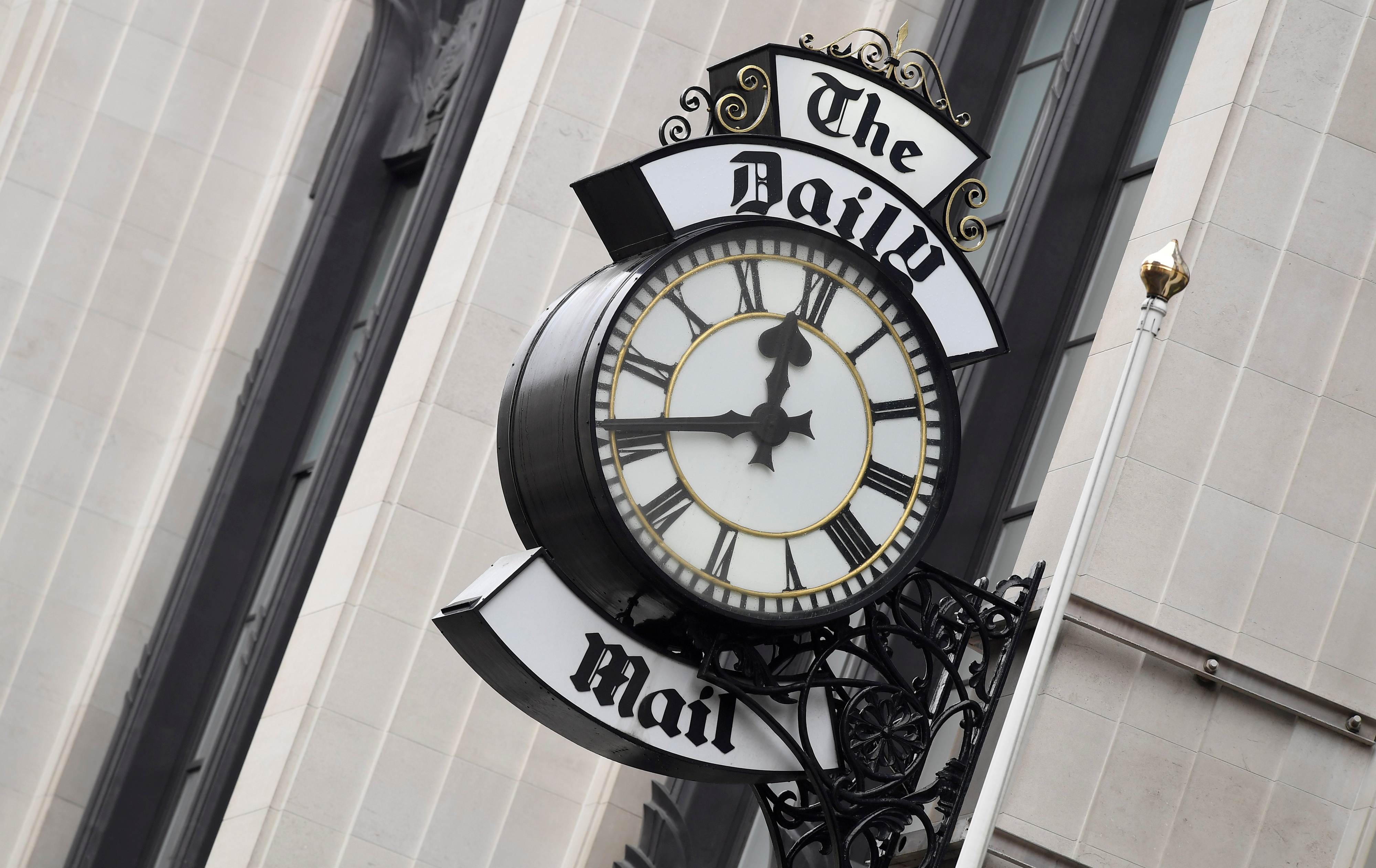 A clock face is seen outside of the London offices of the Daily Mail newspaper in London, Britain