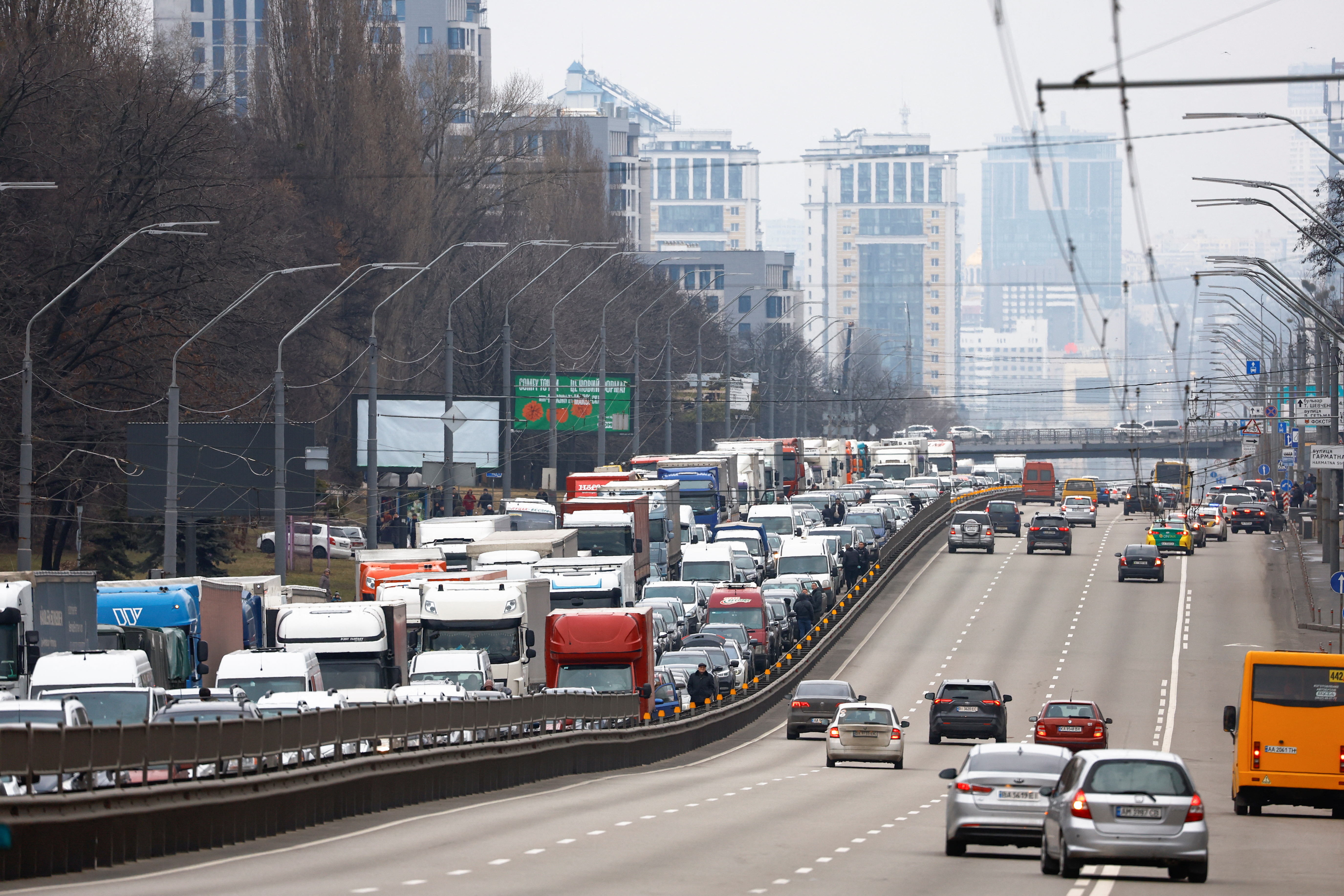 Residents leaving Central Kyiv are pictured stuck in a highway in Kyiv