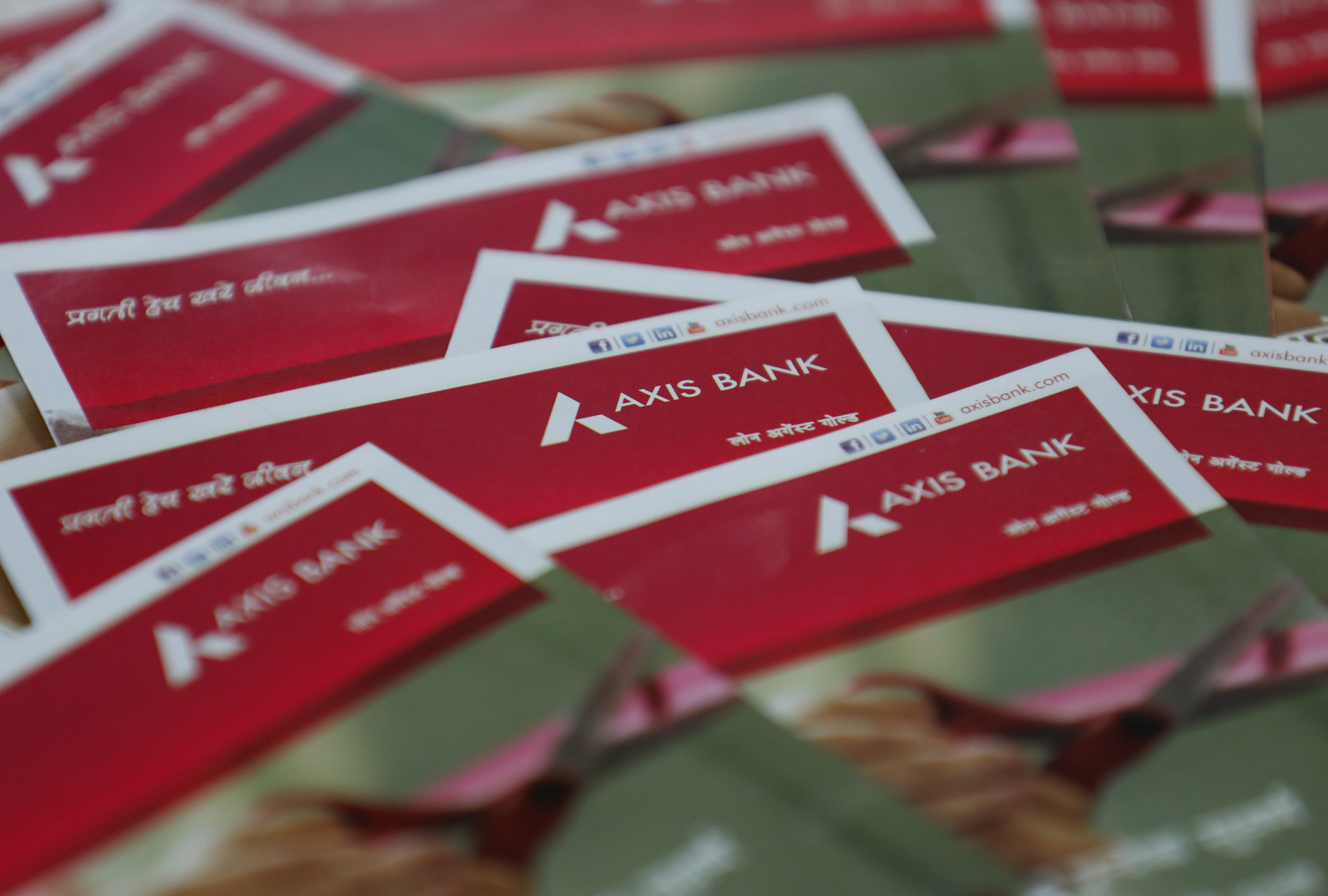Brochures are seen at a branch of Axis Bank in Mumbai
