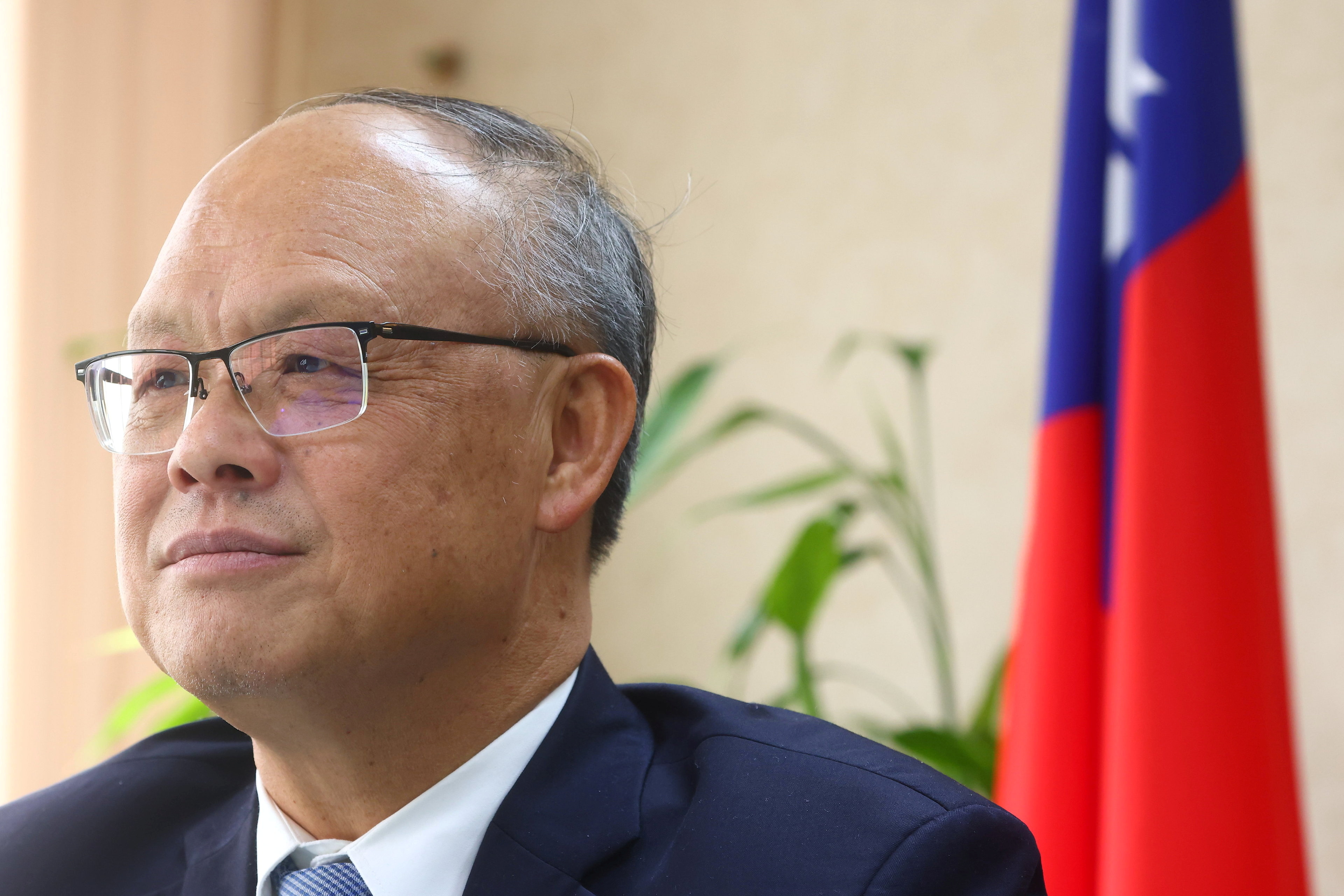 Taiwan's Chief trade negotiator John Deng looks on as he speaks to the media in Taipei