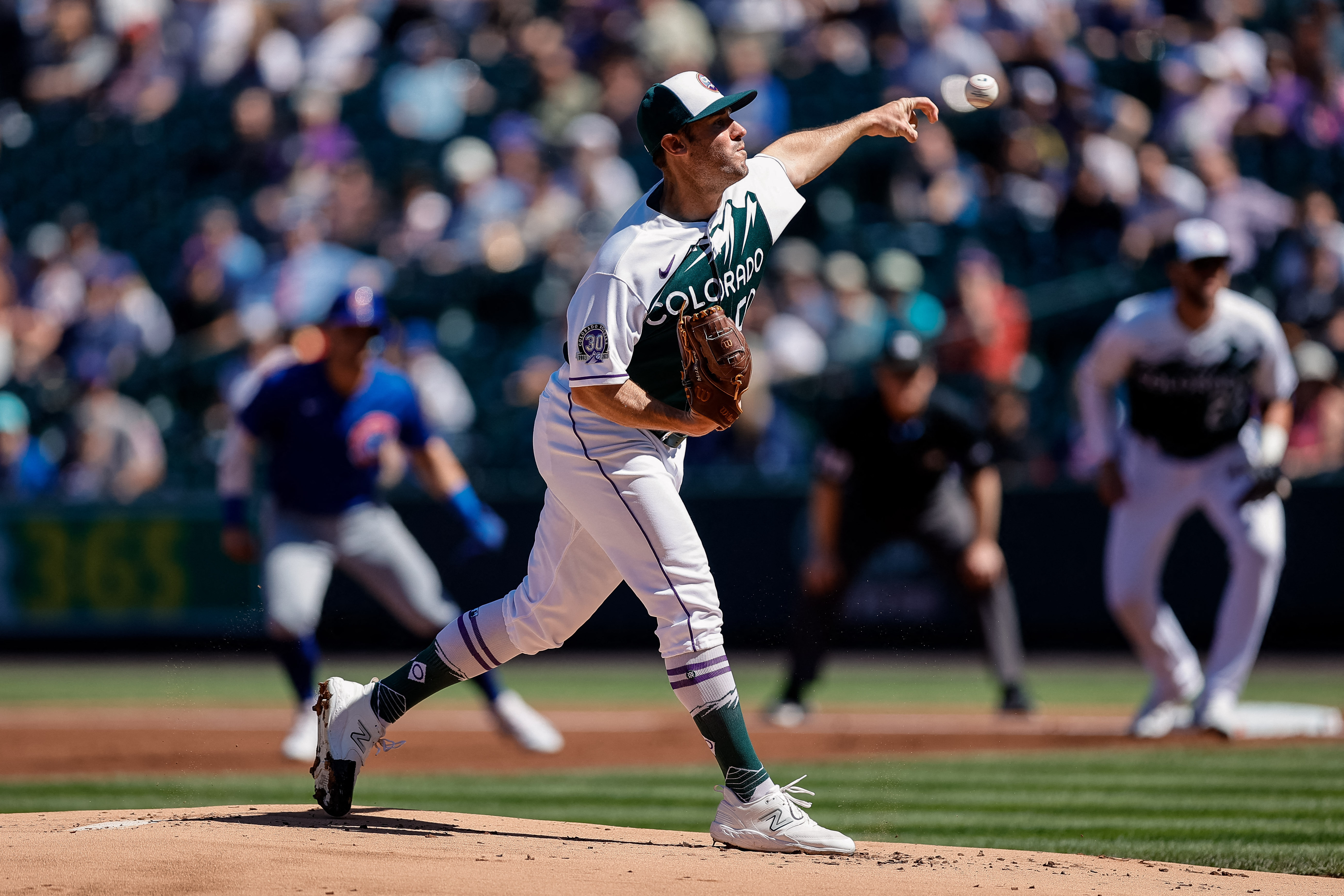 Four homers rally Rockies past Cubs, 7-3