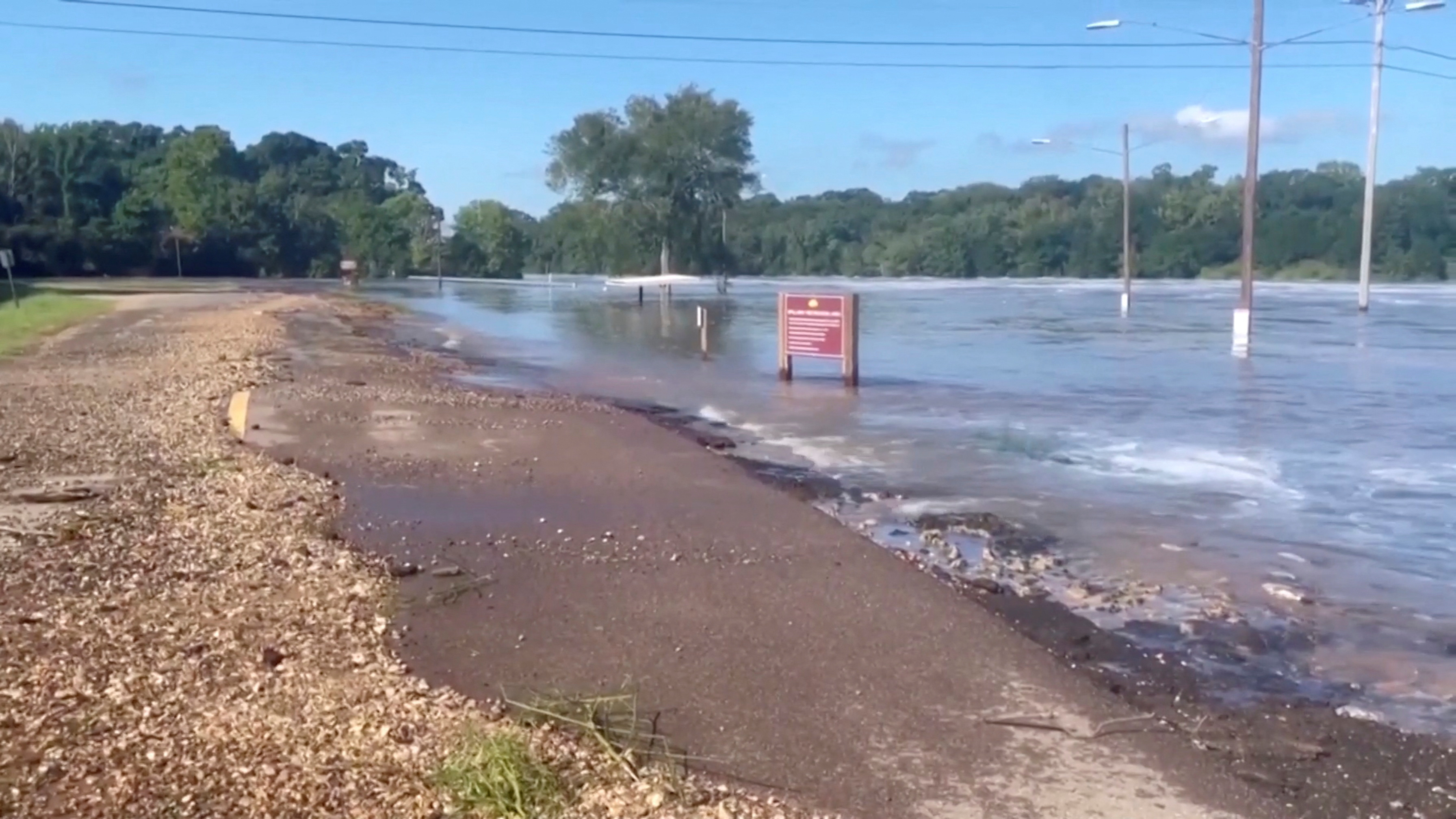 Flood waters in Mississippi cover roads and fields