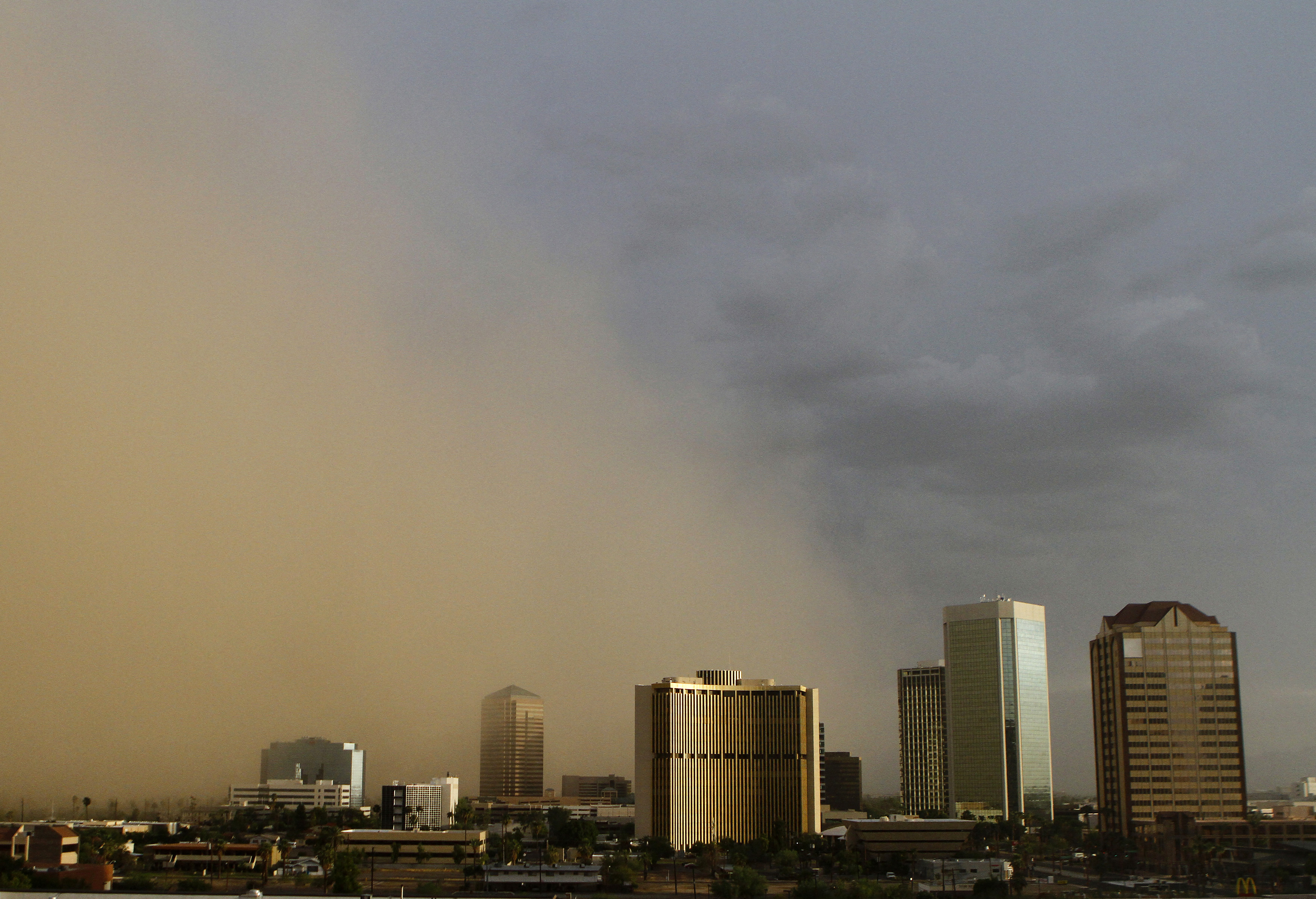 A dust storm surrounds high rise buildings in Phoenix