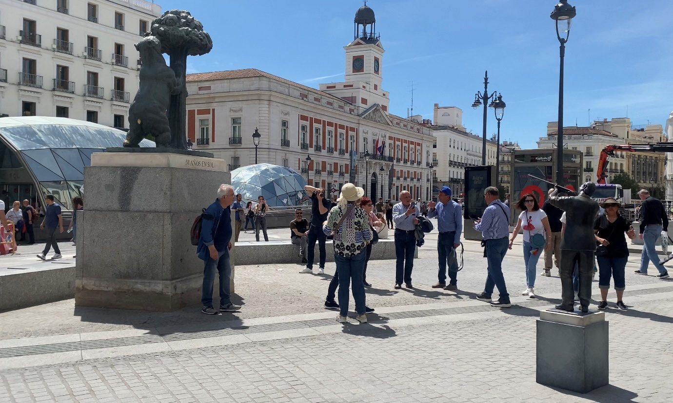 A sculpture of rifle-wielding former Spanish King Juan Carlos I pointing at "Statue of the Bear and the Strawberry Tree" in Madrid