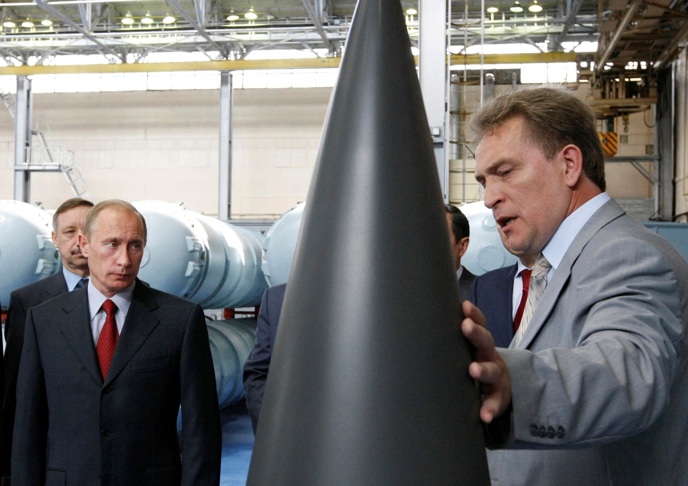 FILE PHOTO: Russian Prime Minister Vladimir Putin listens to the chief executive director of the Almaz-Antey Air Defence firm Vladislav Menschikov during a tour of its plant in Moscow, July 28, 2008. REUTERS/RIA Novosti