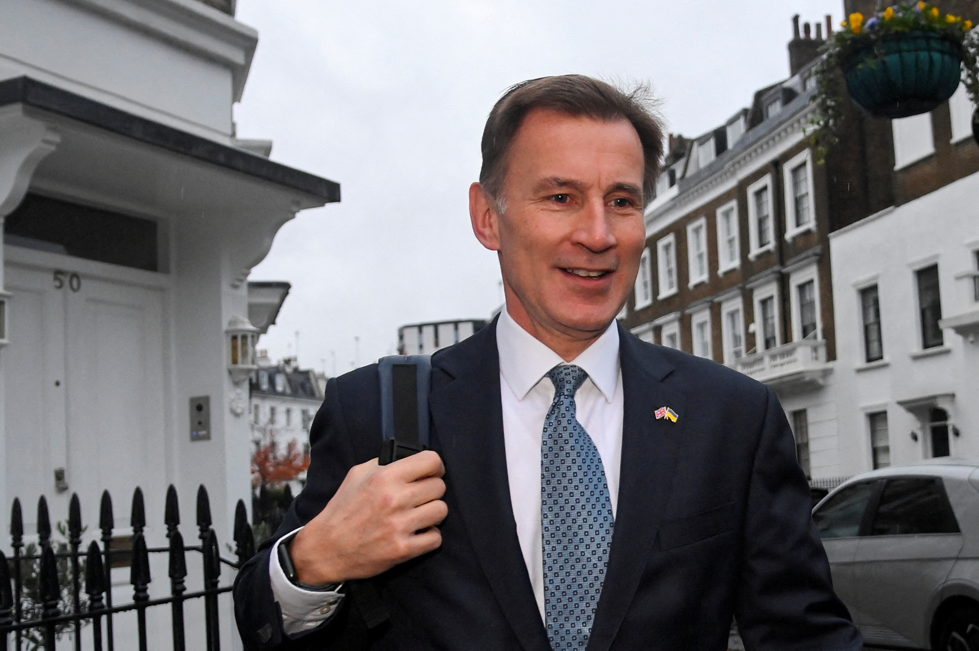 British Chancellor of the Exchequer Jeremy Hunt leaves his home, in London