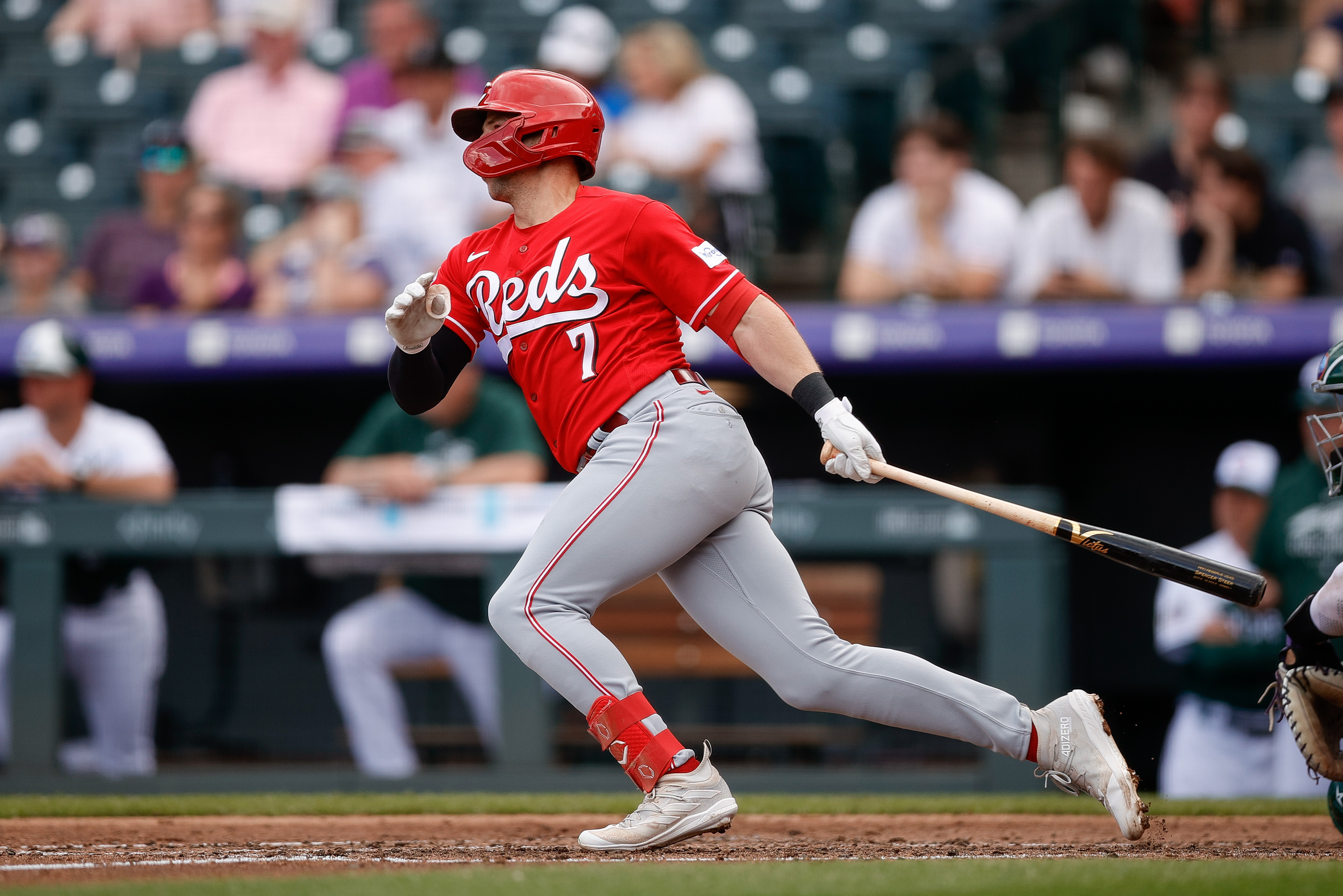 Rockies score 11 runs over 2 innings, rally past Reds 11-6