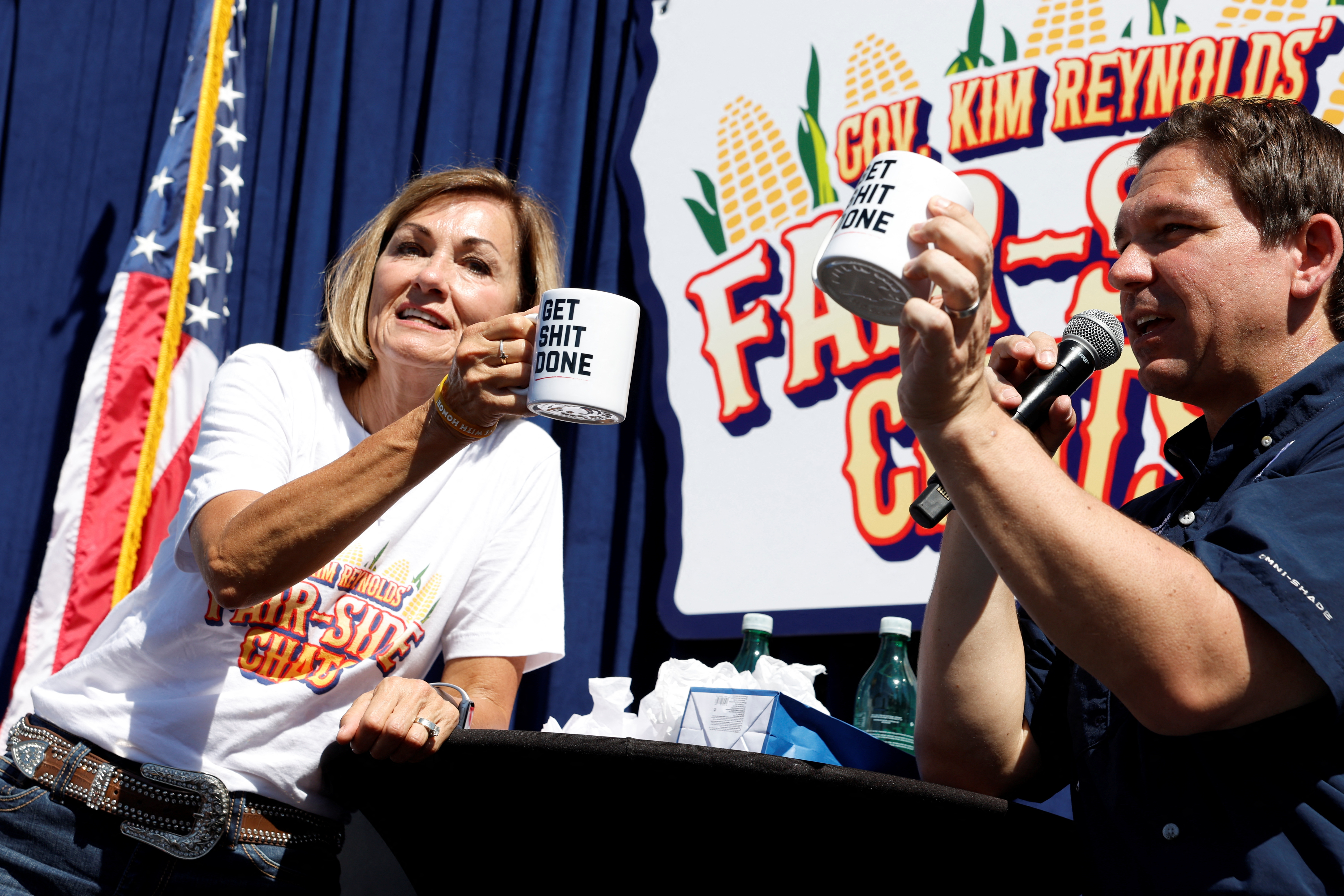 Trump's Iowa campaign rally has stage adorned with mug shot-themed