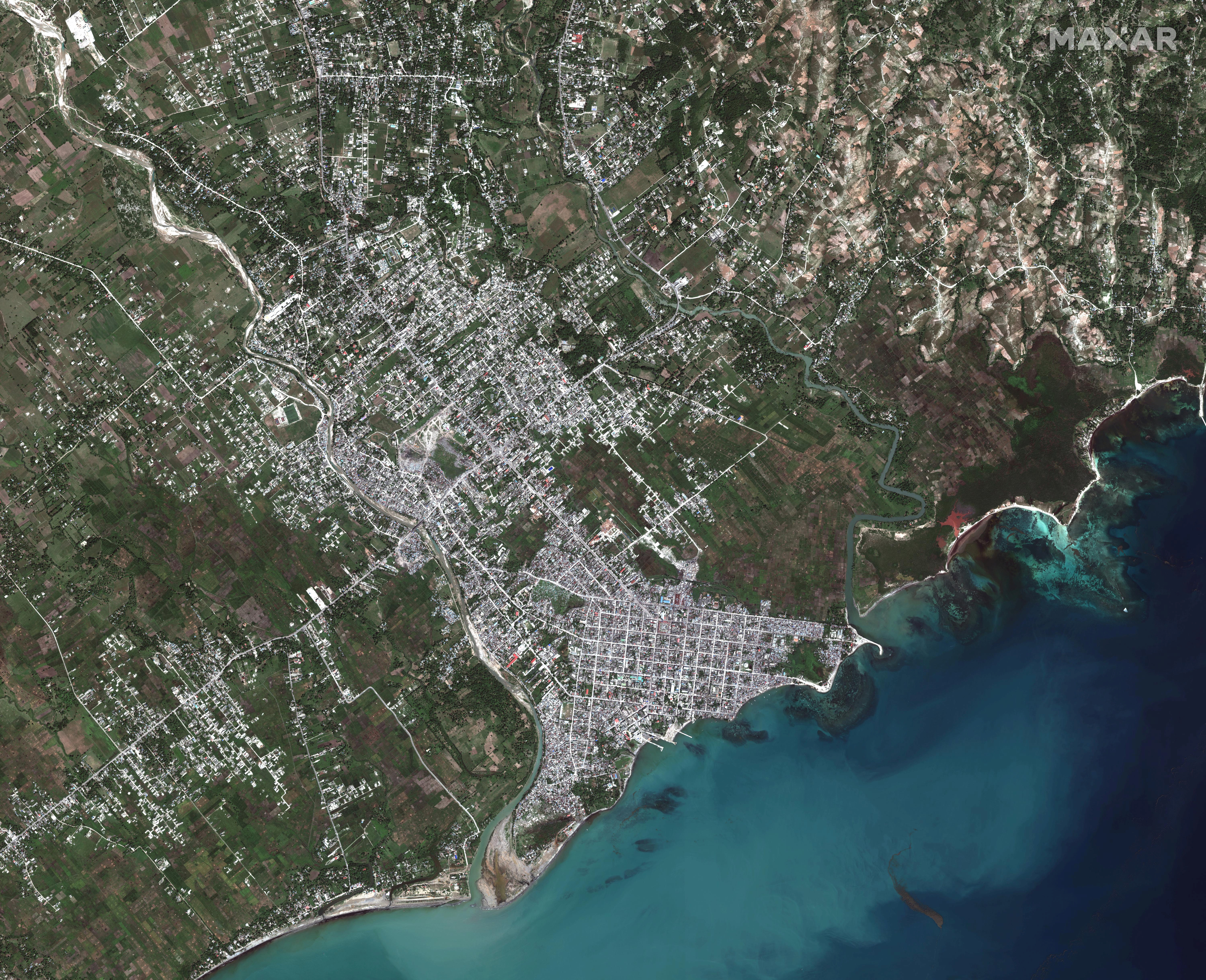 A satellite image shows an overview of the commune of Les Cayes, after a 7.2 magnitude earthquake struck Haiti, August 15, 2021. SATELLITE IMAGE 2021 MAXAR TECHNOLOGIES/Handout via REUTERS 
